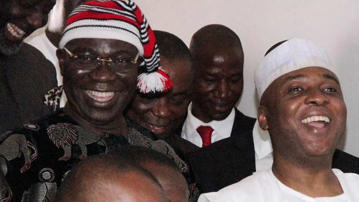 Nigerian Senate president Bukola Saraki (R) and his deputy Ike Ekweremadu (L) leave the courtroom after being charged with falsifying parliamentary rules to get elected in Abuja, on June 27, 2016.  
Nigerian Senate president Bukola Saraki on June 27, 2016 kicked off his corruption trial by denying he falsified parliamentary rules to get elected. The influential Nigerian politician has been charged with two counts of criminal conspiracy and forgery and was in the dock alongside his deputy, Ike Ekweremadu, at the high court in Abuja.
 / AFP / PHILIP OJISUA        (Photo credit should read PHILIP OJISUA/AFP via Getty Images)