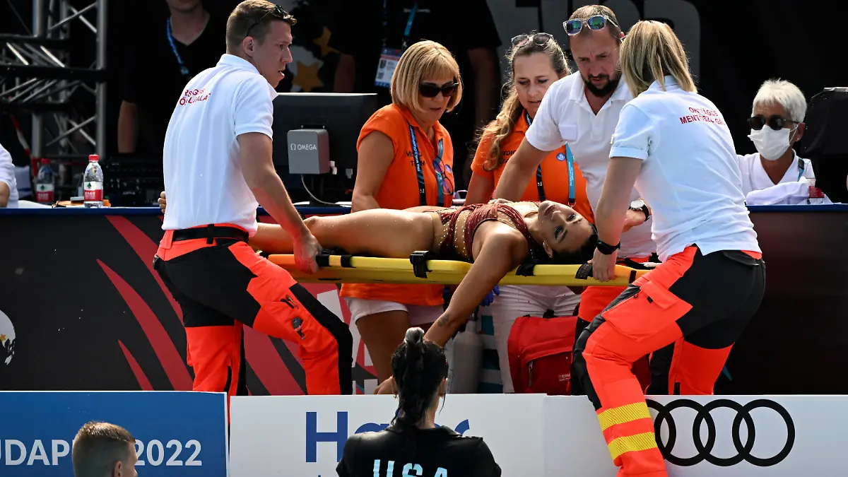 Anita Alvarez of United States is carried on stretcher after collapsing during the solo free final of the artistic swimming at the 19th FINA World Championships in Budapest, Hungary, Wednesday, June 22, 2022. (AP Photo/Anna Szilagyi)