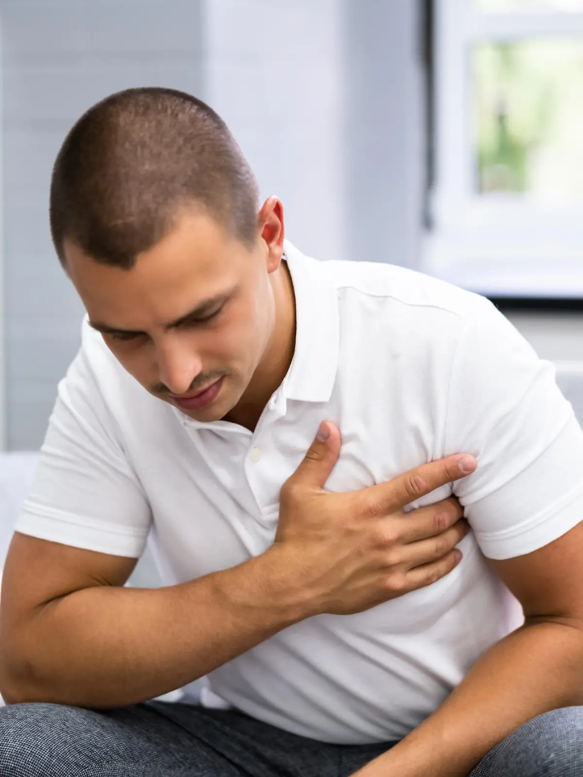 Man Chest Pain. Angina Or Heart Attack