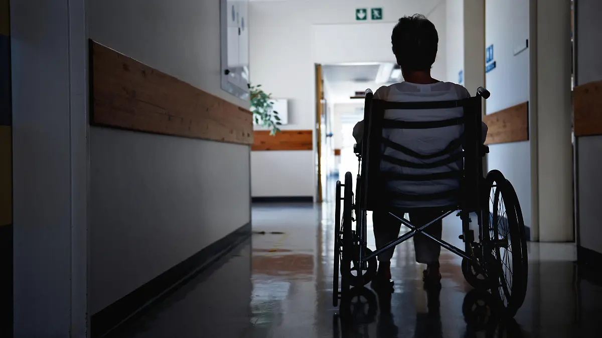 Rearview shot of a senior woman sitting in a wheelchair
