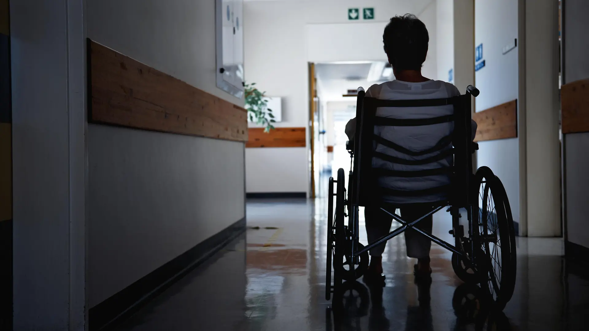 Rearview shot of a senior woman sitting in a wheelchair