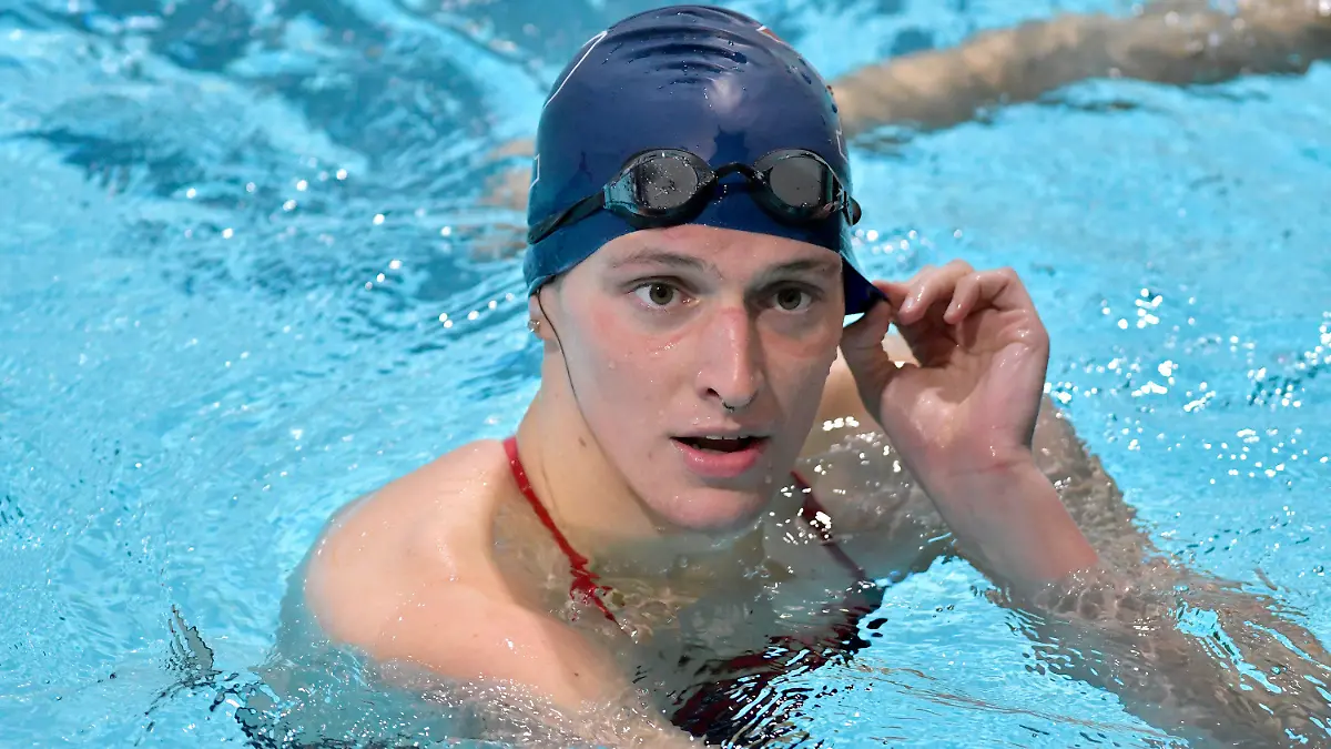 FILE - Transgender swimmer Lia Thomas speaks to her coach after winning the 500 meter freestyle during a meet with Harvard on Jan. 22, 2022, at Harvard University in Cambridge, Mass. In an interview that aired Tuesday, May 31, 2022, on ABC's “Good Morning America,” Thomas disputed those who say she has an unfair biological edge that ruins the integrity of female athletics. (AP Photo/Josh Reynolds, File)