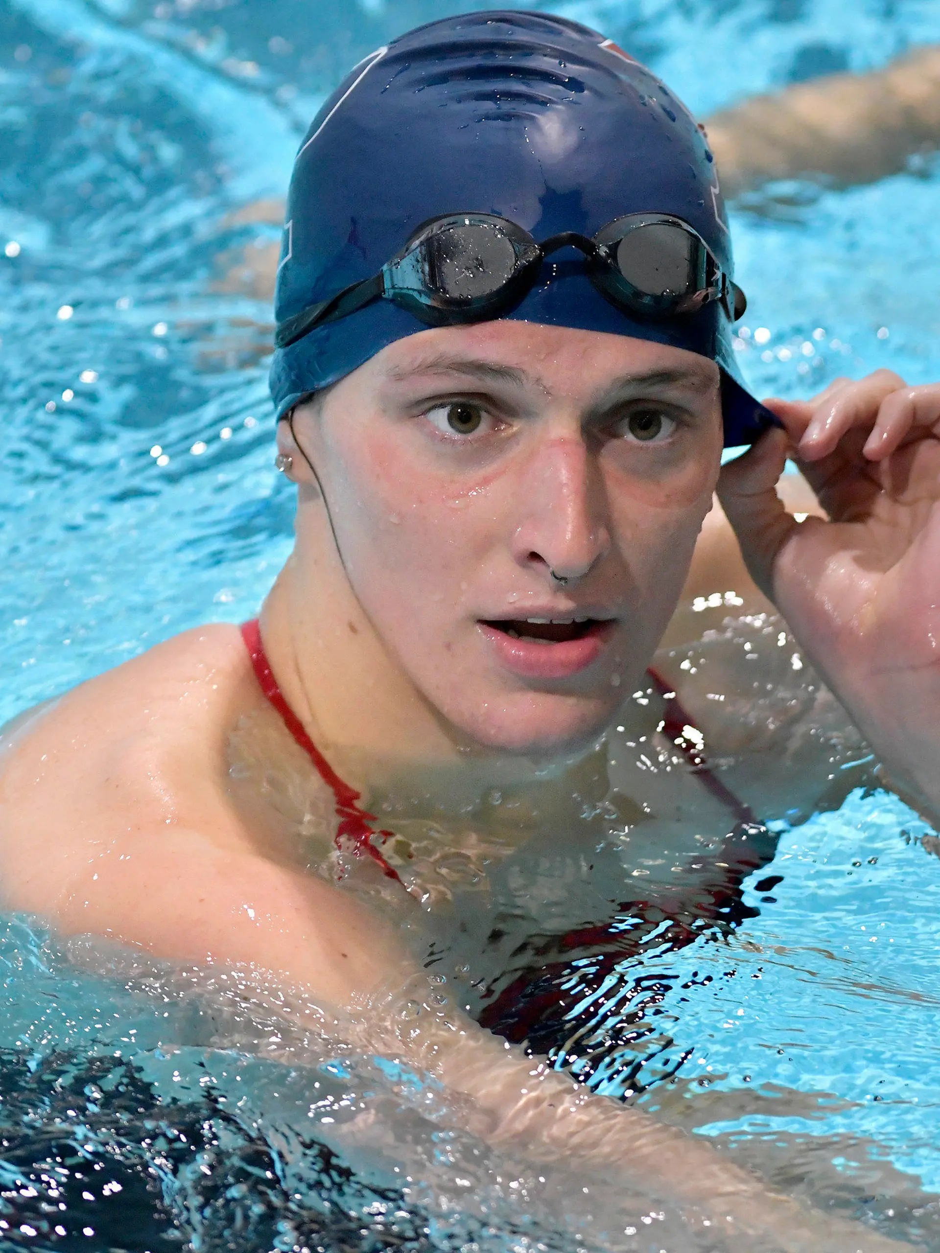 FILE - Transgender swimmer Lia Thomas speaks to her coach after winning the 500 meter freestyle during a meet with Harvard on Jan. 22, 2022, at Harvard University in Cambridge, Mass. In an interview that aired Tuesday, May 31, 2022, on ABC's “Good Morning America,” Thomas disputed those who say she has an unfair biological edge that ruins the integrity of female athletics. (AP Photo/Josh Reynolds, File)