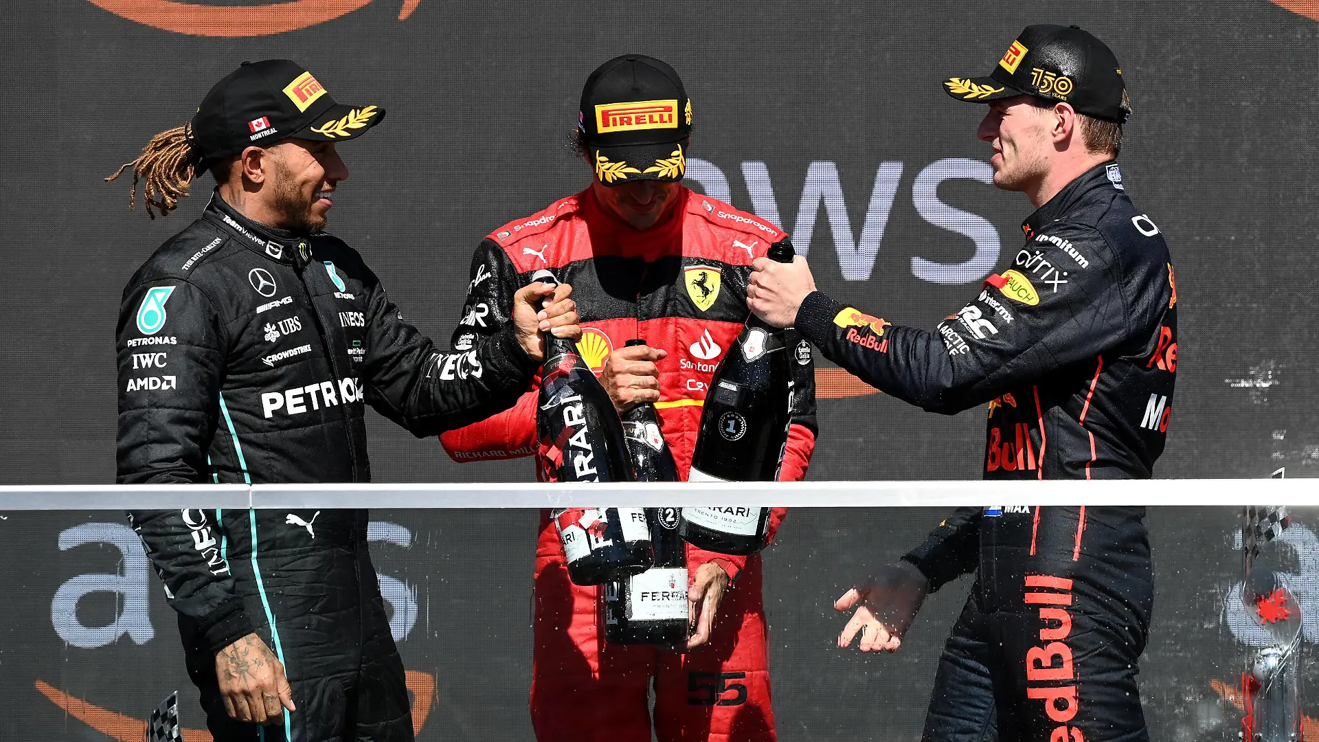  Formula 1 2022: Canadian GP CIRCUIT GILLES-VILLENEUVE, CANADA - JUNE 19: Sir Lewis Hamilton, Mercedes-AMG, 3rd position, Carlos Sainz, Ferrari, 2nd position, and Sir Lewis Hamilton, Mercedes-AMG, 1st position, celebrate on the podium with Champagne during the Canadian GP at Circuit Gilles-Villeneuve on Sunday June 19, 2022 in Montreal, Canada. Photo by Mark Sutton / Sutton Images Images PUBLICATIONxINxGERxSUIxAUTxHUNxONLY GP2209_205434MS1_2729