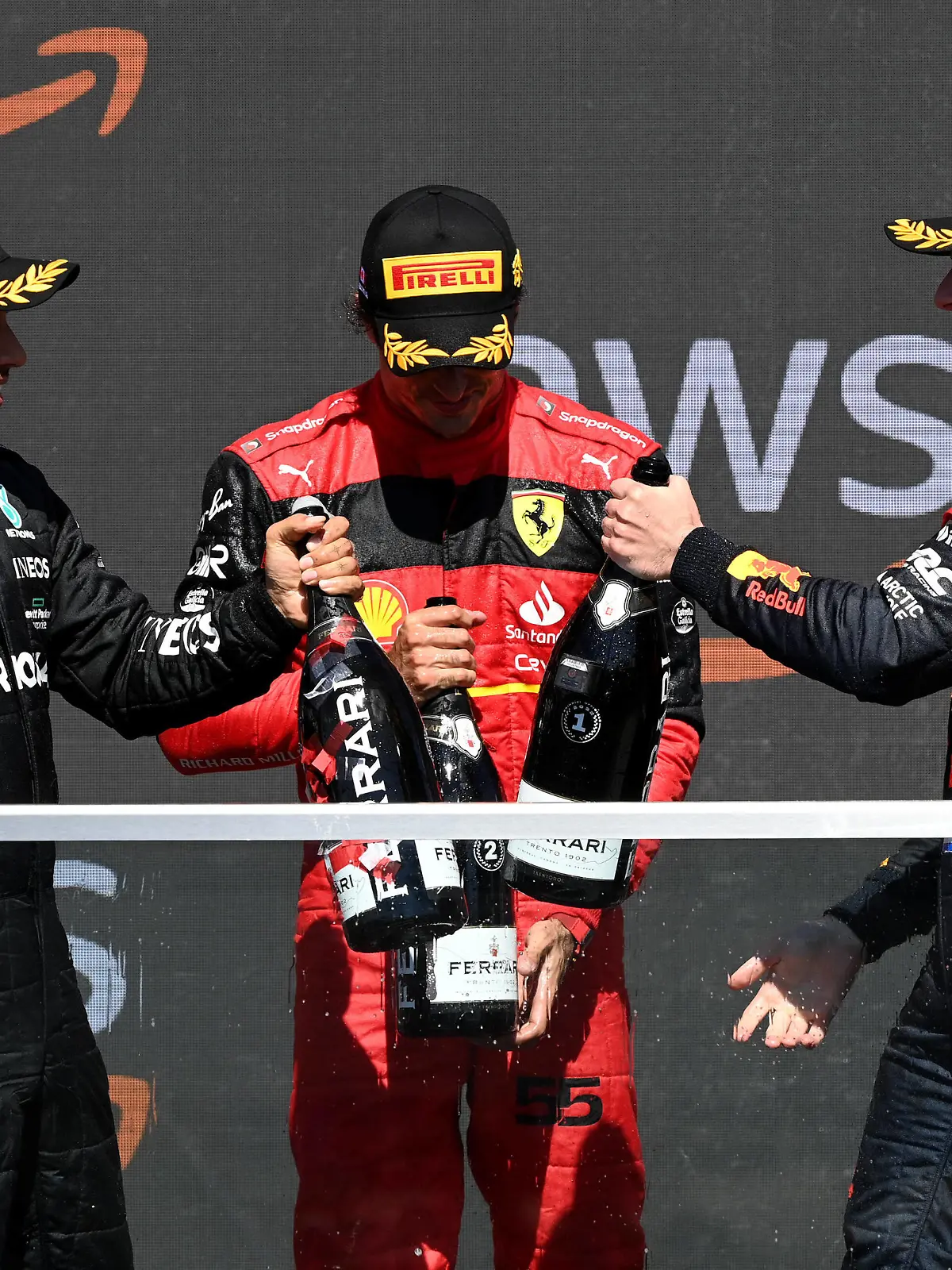  Formula 1 2022: Canadian GP CIRCUIT GILLES-VILLENEUVE, CANADA - JUNE 19: Sir Lewis Hamilton, Mercedes-AMG, 3rd position, Carlos Sainz, Ferrari, 2nd position, and Sir Lewis Hamilton, Mercedes-AMG, 1st position, celebrate on the podium with Champagne during the Canadian GP at Circuit Gilles-Villeneuve on Sunday June 19, 2022 in Montreal, Canada. Photo by Mark Sutton / Sutton Images Images PUBLICATIONxINxGERxSUIxAUTxHUNxONLY GP2209_205434MS1_2729