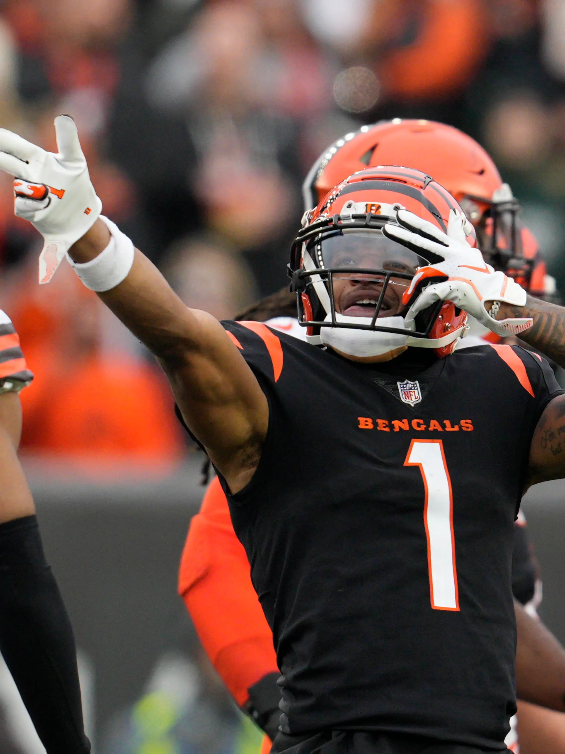 Cincinnati Bengals' Ja'Marr Chase (1) reacts after a first down catch during the second half of an NFL football game against the Cleveland Browns, Sunday, Dec. 11, 2022, in Cincinnati. (AP Photo/Jeff Dean)