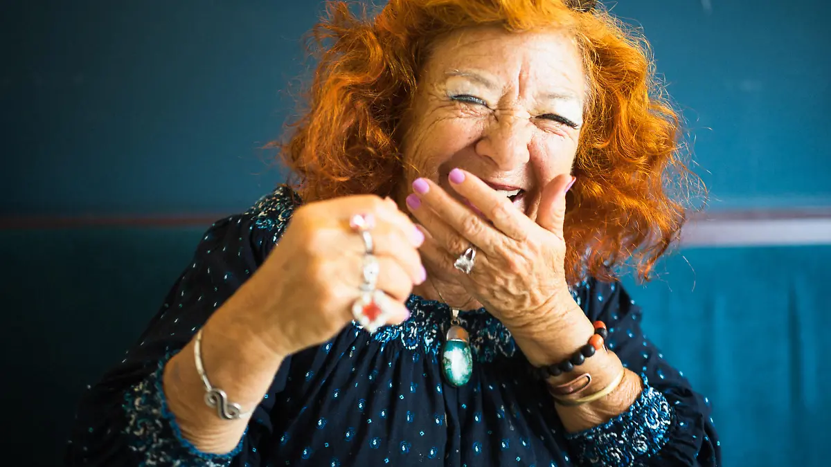 Portrait of an old lady. She laughs heartily to the viewer. She has a friendly and candid character. And a lot of fun!