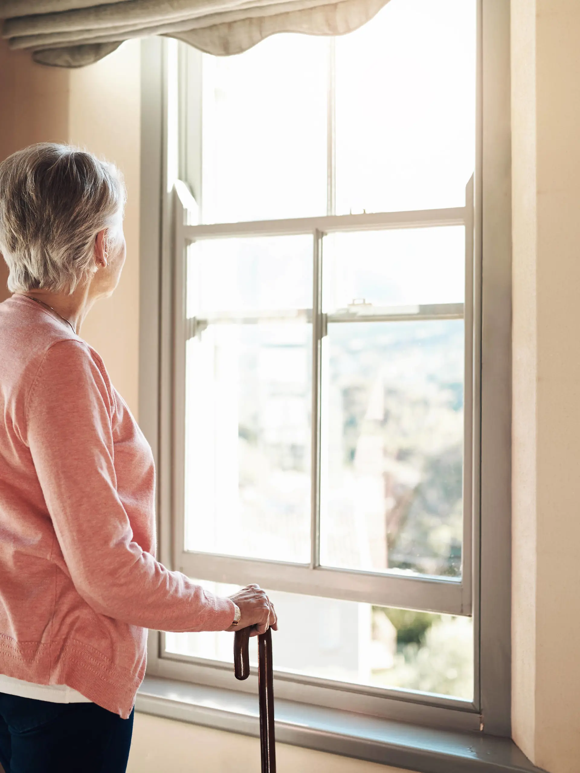 When did the days become so grey. Shot of a senior woman with a cane looking thoughtfully out of a window at home. Shot of a senior woman with a cane looking thoughtfully out of a window at home. Copyright: xZoonar.com/YurixArcursxpeopleimages.comx 18546264 ,model released, Symbolfoto ,property released