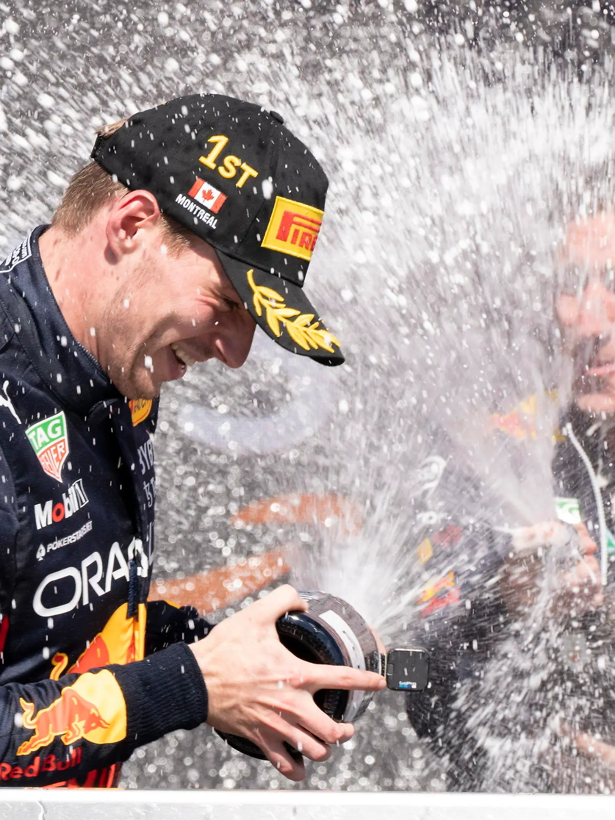 Red Bull Racing Max Verstappen, of the Netherlands, is sprayed with champagne by members of his team after winning the Canadian Grand Prix in Montreal on Sunday, June 19, 2022. (Paul Chiasson/The Canadian Press via AP)