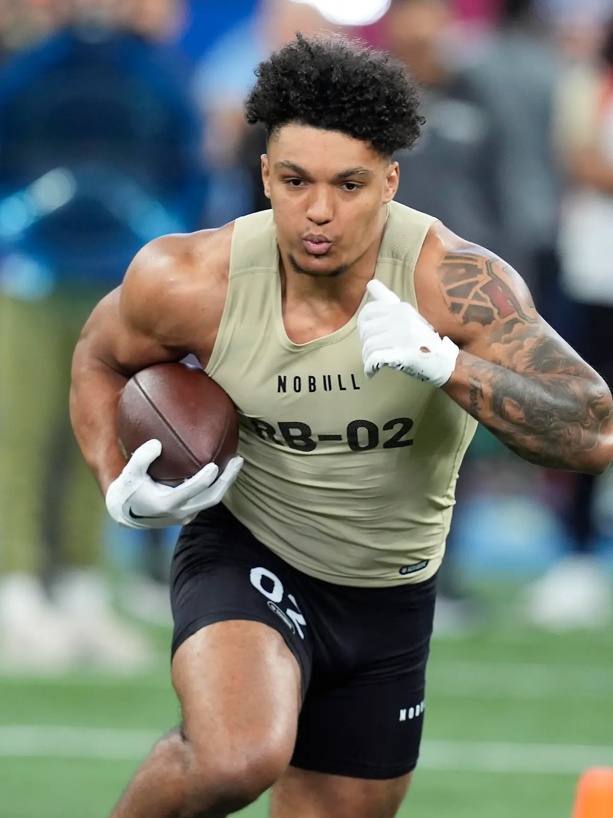 Wisconsin running back Braelon Allen runs a drill at the NFL football scouting combine, Saturday, March 2, 2024, in Indianapolis. (AP Photo/Darron Cummings)