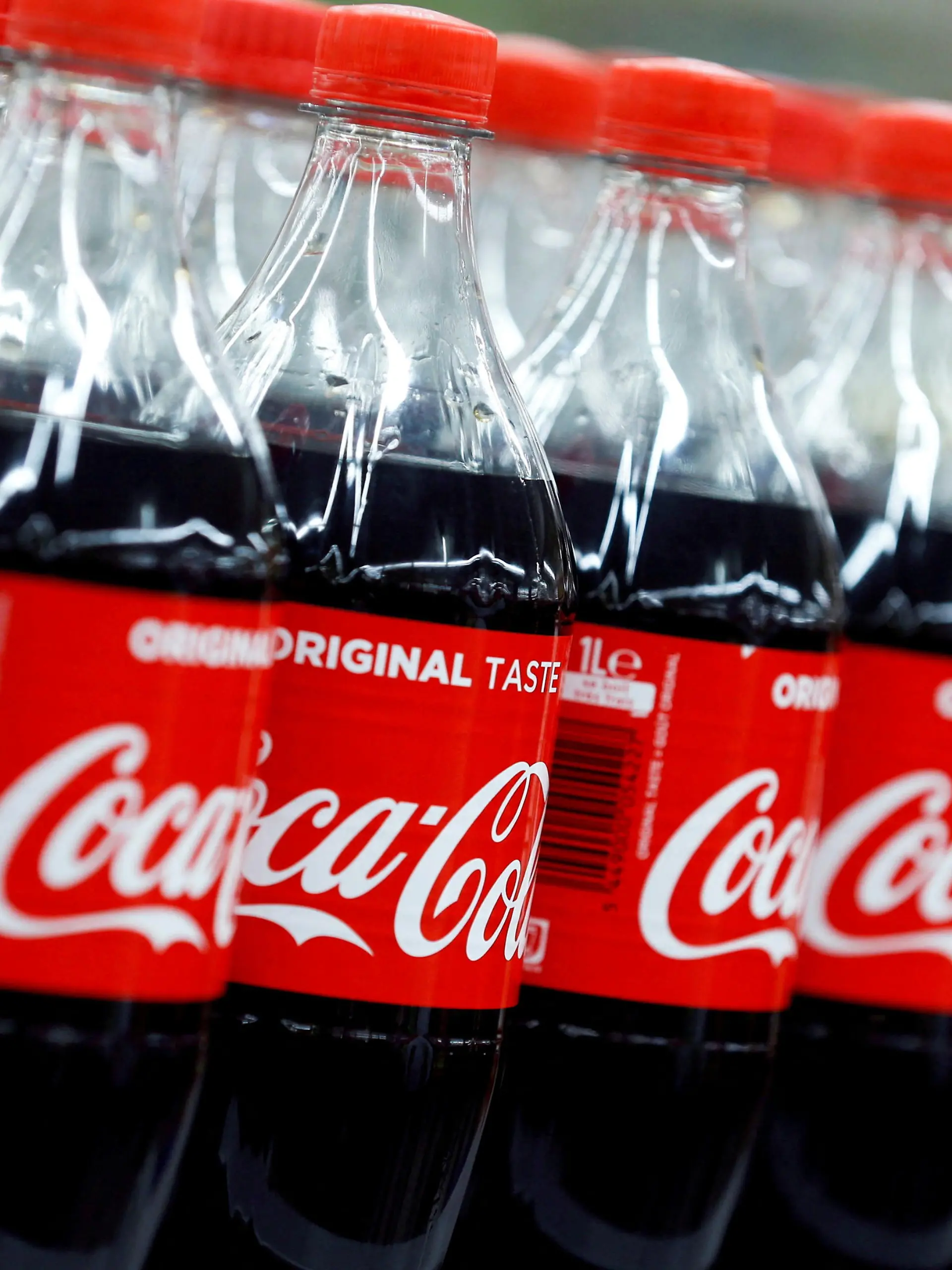 FILE PHOTO: FILE PHOTO: Bottles of Coca-Cola are seen at a Carrefour Hypermarket store in Montreuil, near Paris, France, February 5, 2018.  REUTERS/Regis Duvignau/File Photo  GLOBAL BUSINESS WEEK AHEAD/File Photo