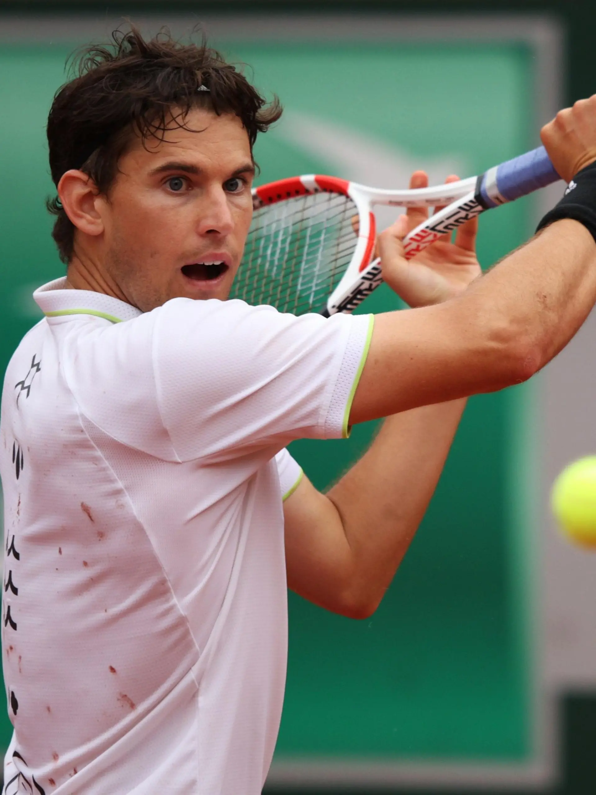 PARIS, FRANCE - MAY 22: Dominic Thiem of Austria plays a backhand during his mens singles first round against Hugo Dellien of Bolivia on day 1 of the 2022 French Open at Roland Garros on May 22, 2022 in Paris, France. (Photo by Adam Pretty/Getty Images)
