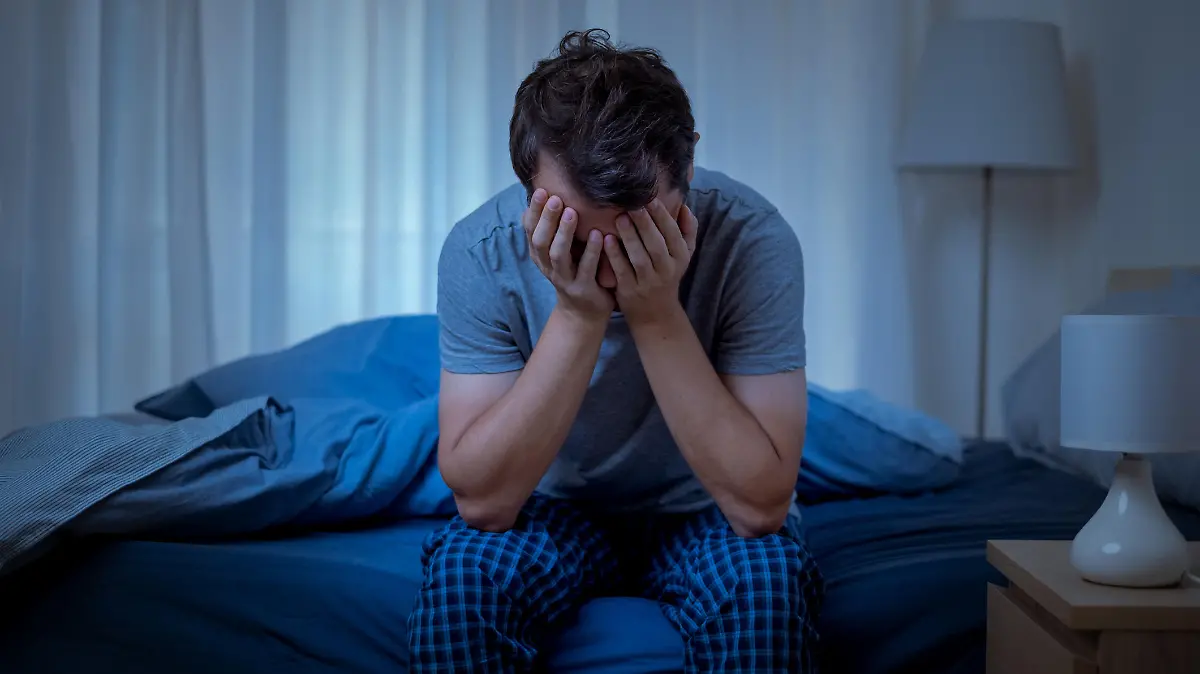 Depressed man at night feeling alone and useless