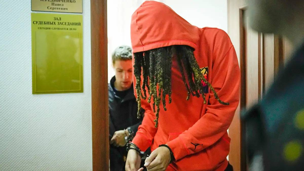 FILE - WNBA star and two-time Olympic gold medalist Brittney Griner leaves a courtroom after a hearing, in Khimki just outside Moscow, May 13, 2022. Griner, a two-time Olympic gold medalist, was detained at the Moscow airport in February after vape cartridges containing oil derived from cannabis were allegedly found in her luggage, which could carry a maximum penalty of 10 years in prison. (AP Photo/Alexander Zemlianichenko, File)