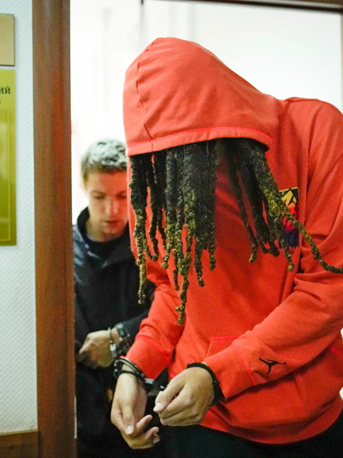 FILE - WNBA star and two-time Olympic gold medalist Brittney Griner leaves a courtroom after a hearing, in Khimki just outside Moscow, May 13, 2022. Griner, a two-time Olympic gold medalist, was detained at the Moscow airport in February after vape cartridges containing oil derived from cannabis were allegedly found in her luggage, which could carry a maximum penalty of 10 years in prison. (AP Photo/Alexander Zemlianichenko, File)