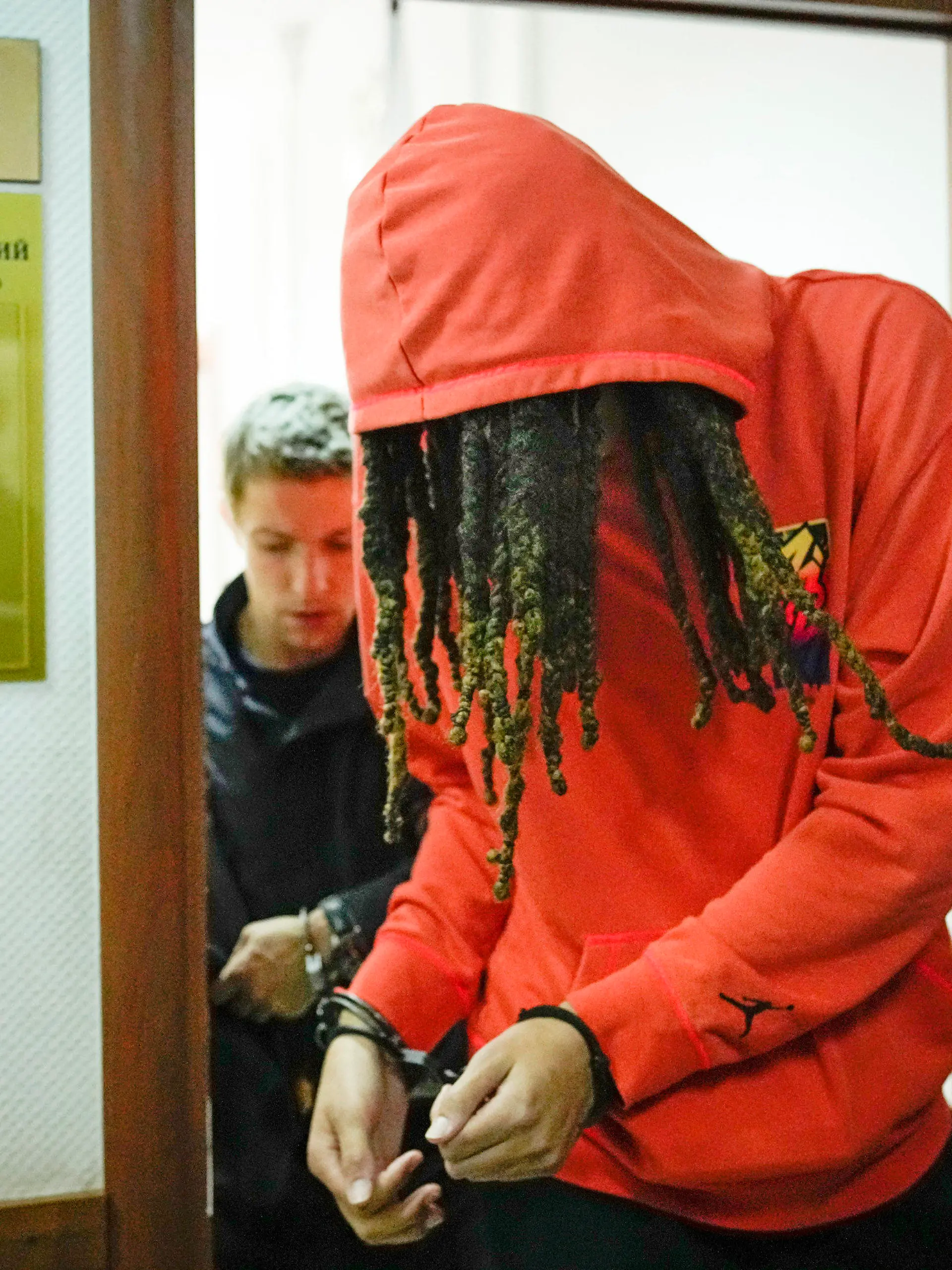 FILE - WNBA star and two-time Olympic gold medalist Brittney Griner leaves a courtroom after a hearing, in Khimki just outside Moscow, May 13, 2022. Griner, a two-time Olympic gold medalist, was detained at the Moscow airport in February after vape cartridges containing oil derived from cannabis were allegedly found in her luggage, which could carry a maximum penalty of 10 years in prison. (AP Photo/Alexander Zemlianichenko, File)