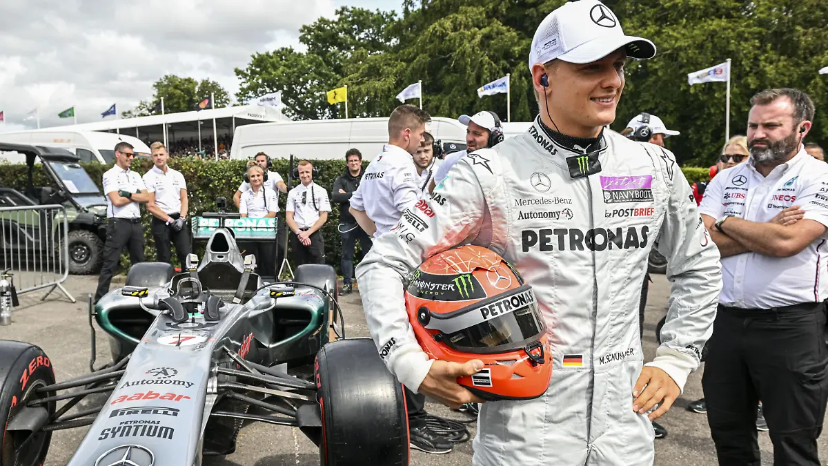Goodwood Festival of Speed - 2023. EDITORIAL USE ONLY Mick Schumacher beside his father's Mercedes W02 which he drove during the 2011 Formula 1 season at the Goodwood Festival of Speed at Goodwood House in West Sussex. Picture date: Sunday June 16, 2023. This year, the event celebrates its 30th anniversary and takes place from June 13-16. Picture credit should read: John Nguyen/PA Wire. URN:73023273