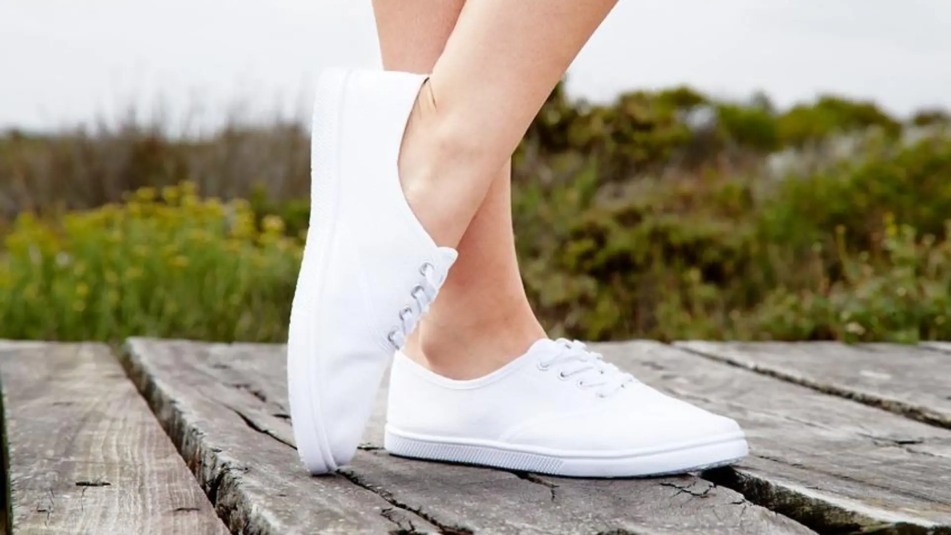 Close up of model in white sneakers