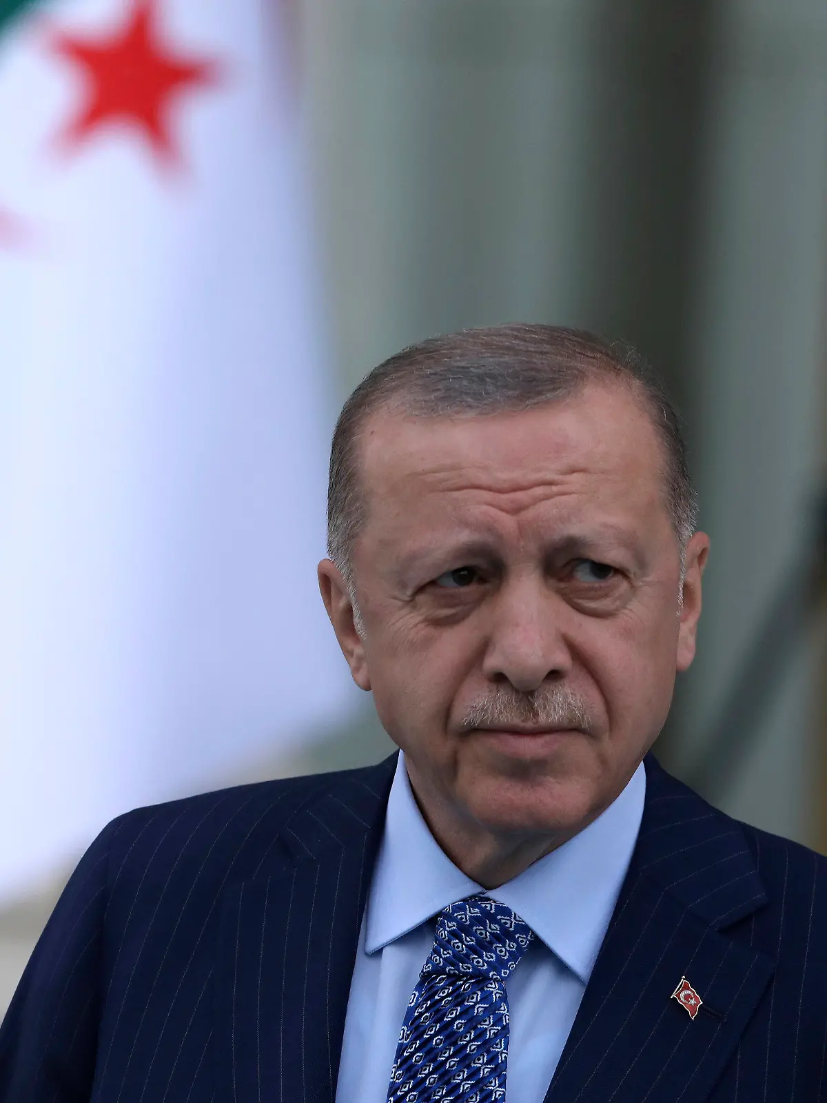 FILE - Turkish President Recep Tayyip Erdogan arrives for a ceremony, in Ankara, Turkey, May 16, 2022. Analysts say Erdogan is taking advantage of the war in Ukraine to push his own agenda in Syria — even using Turkey’s veto powers as a NATO member to block alliance membership by Finland and Sweden as potential leverage. But an incursion by Ankara would be risky, threatening to upset its ties with both the United States and Russia.  (AP Photo/Burhan Ozbilici, File)