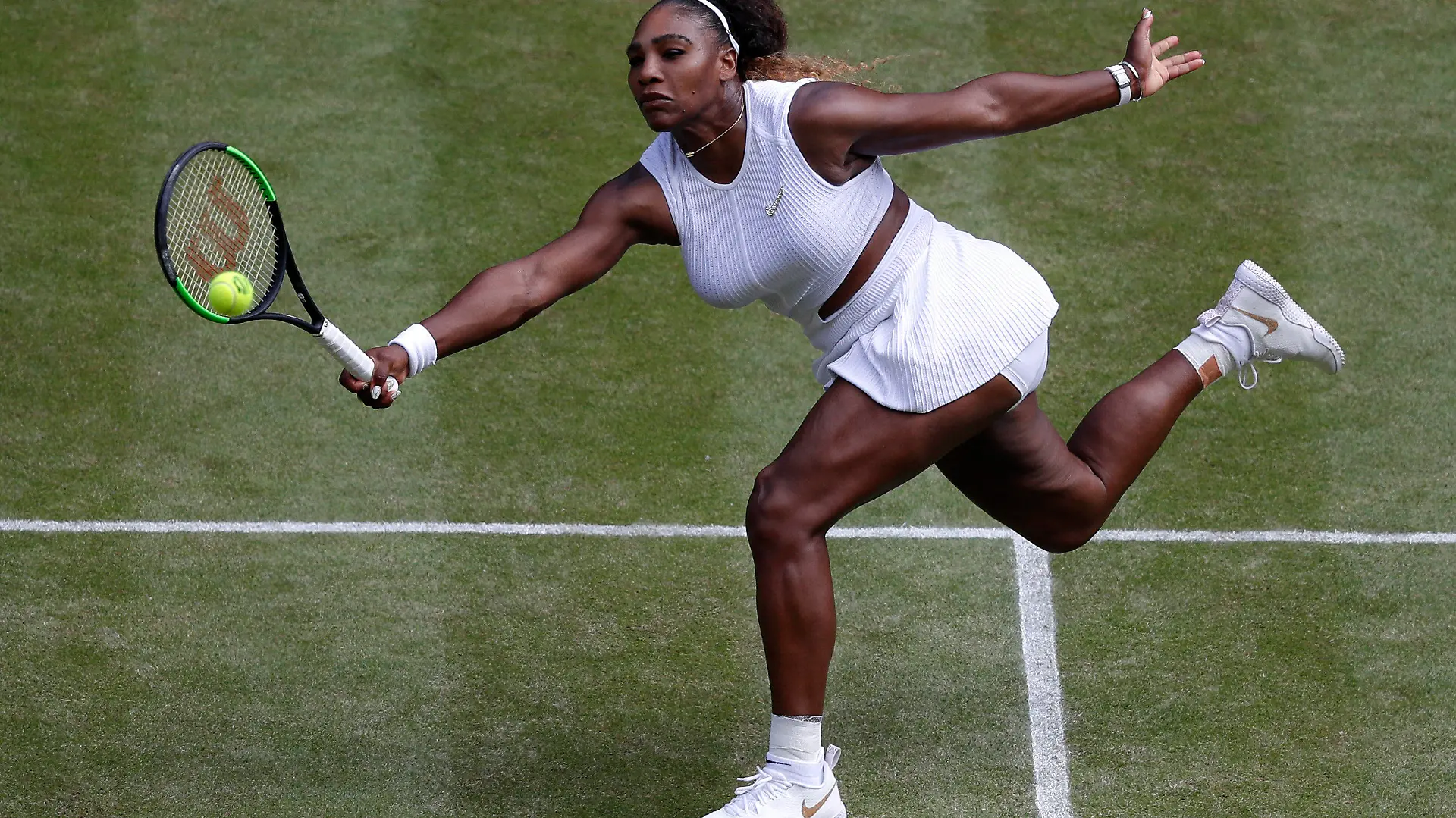FILE - Serena Williams returns to Czech Republic's Barbora Strycova during a women's singles semifinal match on day ten of the Wimbledon Tennis Championships in London, Thursday, July 11, 2019. Serena Williams is going to play at Wimbledon this year, after all. The All England Club announced via Twitter on Tuesday, June 14, 2022, that Williams was awarded a wild-card entry for singles.(AP Photo/Alastair Grant, File)