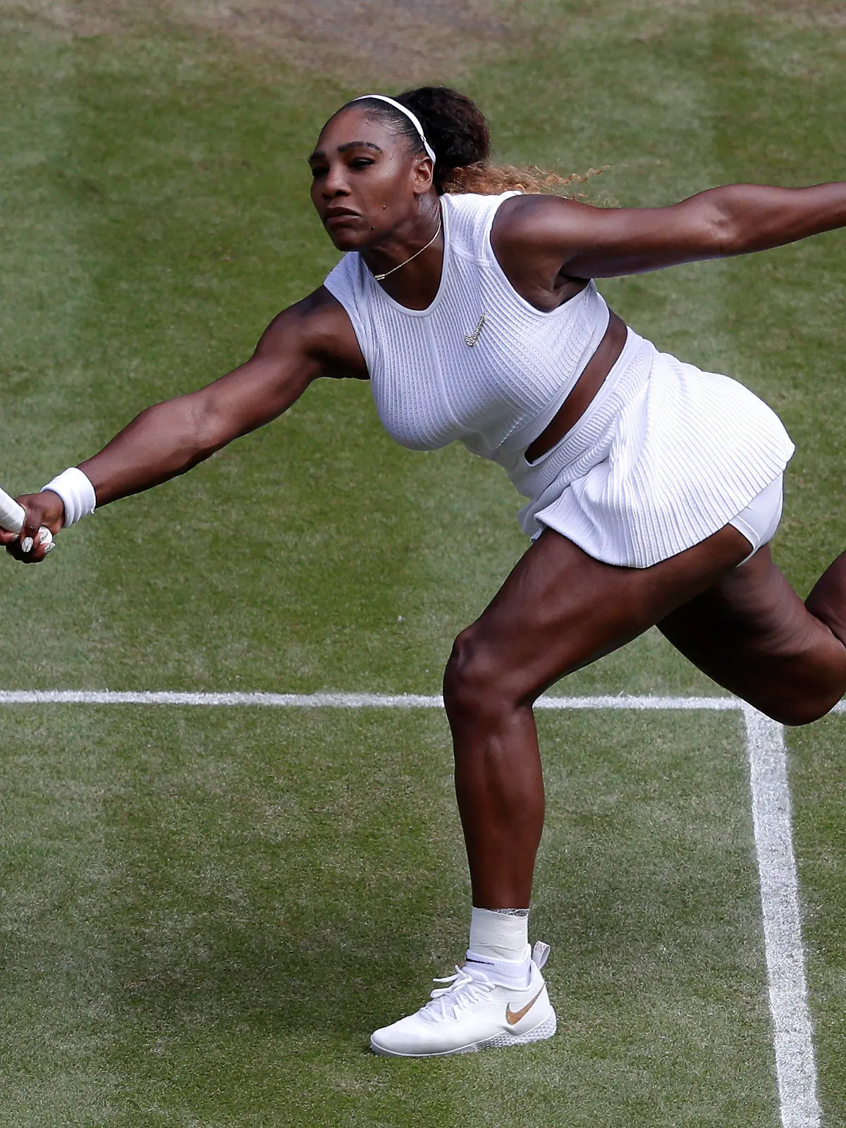 FILE - Serena Williams returns to Czech Republic's Barbora Strycova during a women's singles semifinal match on day ten of the Wimbledon Tennis Championships in London, Thursday, July 11, 2019. Serena Williams is going to play at Wimbledon this year, after all. The All England Club announced via Twitter on Tuesday, June 14, 2022, that Williams was awarded a wild-card entry for singles.(AP Photo/Alastair Grant, File)