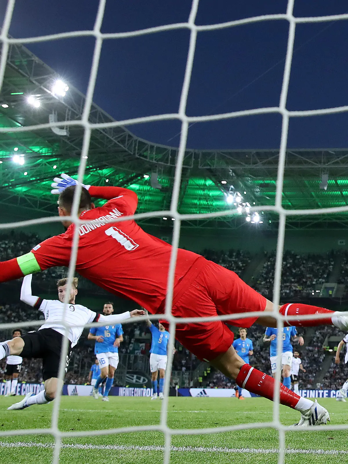 MOENCHENGLADBACH, GERMANY - JUNE 14: Timo Werner of Germany scores their team's fourth goal past Gianluigi Donnarumma of Italy during the UEFA Nations League - League A Group 3 match between Germany and Italy at Borussia Park Stadium on June 14, 2022 in Moenchengladbach, Germany. (Photo by Alex Grimm/Getty Images)