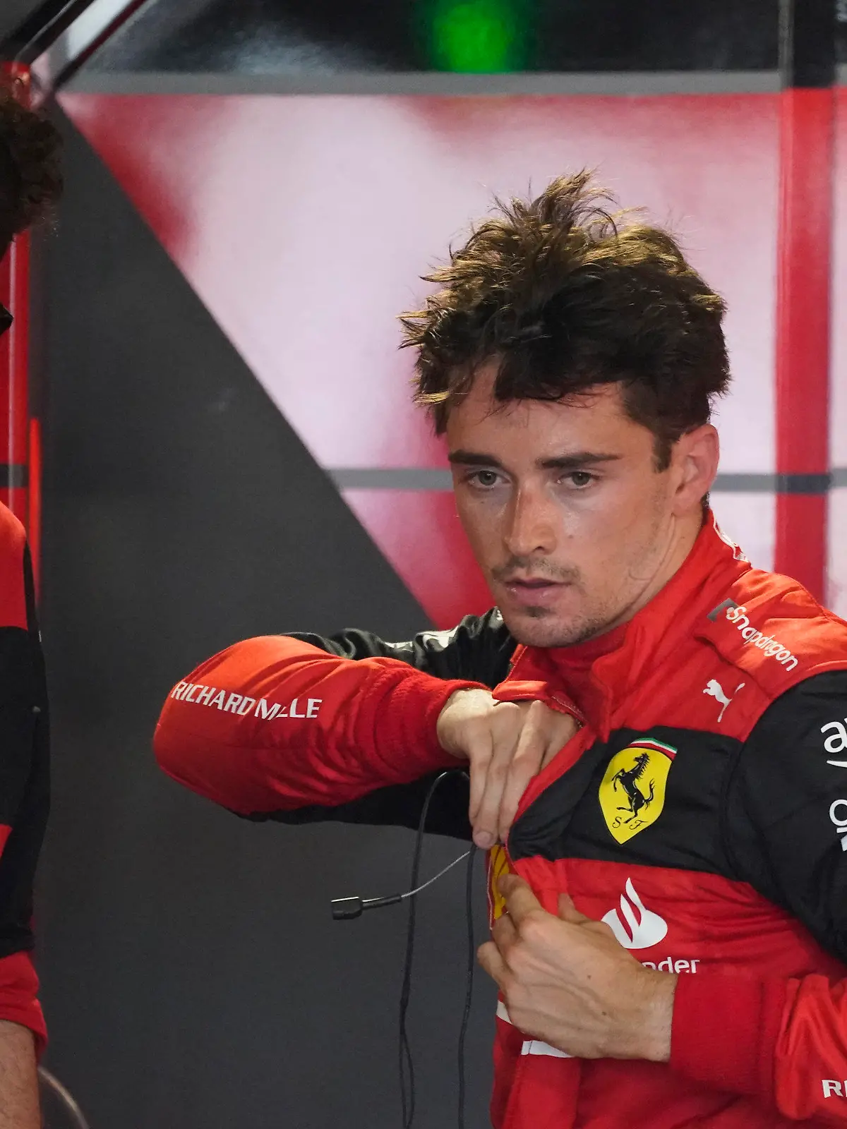 Ferrari driver Charles Leclerc of Monaco speaks with Ferrari team principal Mattia Binotto following the first practice session for the Formula One Miami Grand Prix auto race at the Miami International Autodrome, Friday, May 6, 2022, in Miami Gardens, Fla. (AP Photo/Darron Cummings)