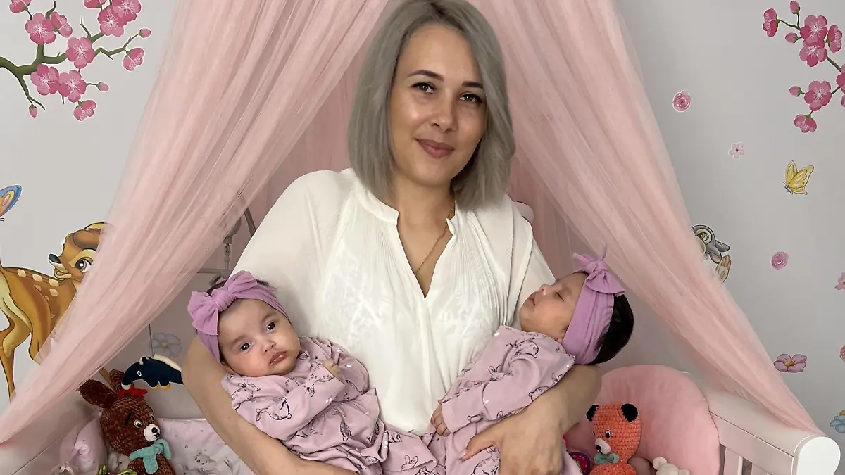 PIC FROM Kennedy News and Media (PICTURED: ALINA LUCA (30) FROM BECKTON, NEWHAM, EAST LONDON WITH HER 'MIRACLE' TWINS ELLIE CARMEA [LEFT] AND MILLIE CARMEA (2 MONTHS)) A mum who 'gave up' trying for more kids after being told she only had a five percent chance of conceiving reveals how she had her 'miracle' twins after falling pregnant TWICE in one week. Alina Luca said she'd always dreamed of having a big family but her chances were hindered by an underactive thyroid and after two years of trying for a second child with partner Rick Carmea, she decided to give up. But a month later, the 30-year-old found out she was pregnant and during her 12-week scan discovered she was actually expecting two babies - that had been conceived a week apart. DISCLAIMER: While Kennedy News and Media uses its best endeavours to establish the copyright and authenticity of all pictures supplied, it accepts no liability for any damage, loss or legal action caused by the use of images supplied and the publication of images is solely at your discretion. SEE KENNEDY NEWS COPY - 0161 697 4266