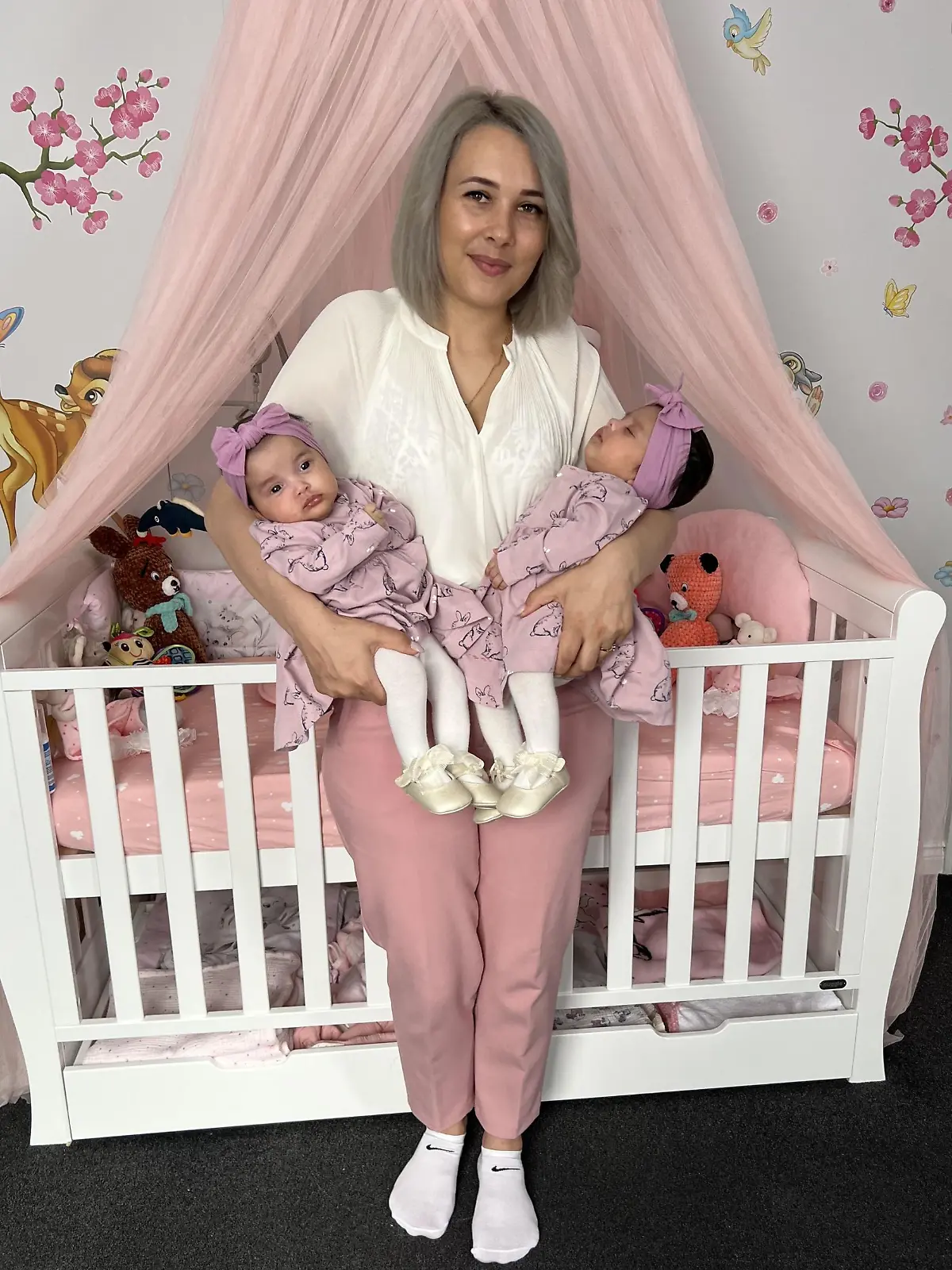 PIC FROM Kennedy News and Media (PICTURED: ALINA LUCA (30) FROM BECKTON, NEWHAM, EAST LONDON WITH HER 'MIRACLE' TWINS ELLIE CARMEA [LEFT] AND MILLIE CARMEA (2 MONTHS)) A mum who 'gave up' trying for more kids after being told she only had a five percent chance of conceiving reveals how she had her 'miracle' twins after falling pregnant TWICE in one week. Alina Luca said she'd always dreamed of having a big family but her chances were hindered by an underactive thyroid and after two years of trying for a second child with partner Rick Carmea, she decided to give up. But a month later, the 30-year-old found out she was pregnant and during her 12-week scan discovered she was actually expecting two babies - that had been conceived a week apart. DISCLAIMER: While Kennedy News and Media uses its best endeavours to establish the copyright and authenticity of all pictures supplied, it accepts no liability for any damage, loss or legal action caused by the use of images supplied and the publication of images is solely at your discretion. SEE KENNEDY NEWS COPY - 0161 697 4266