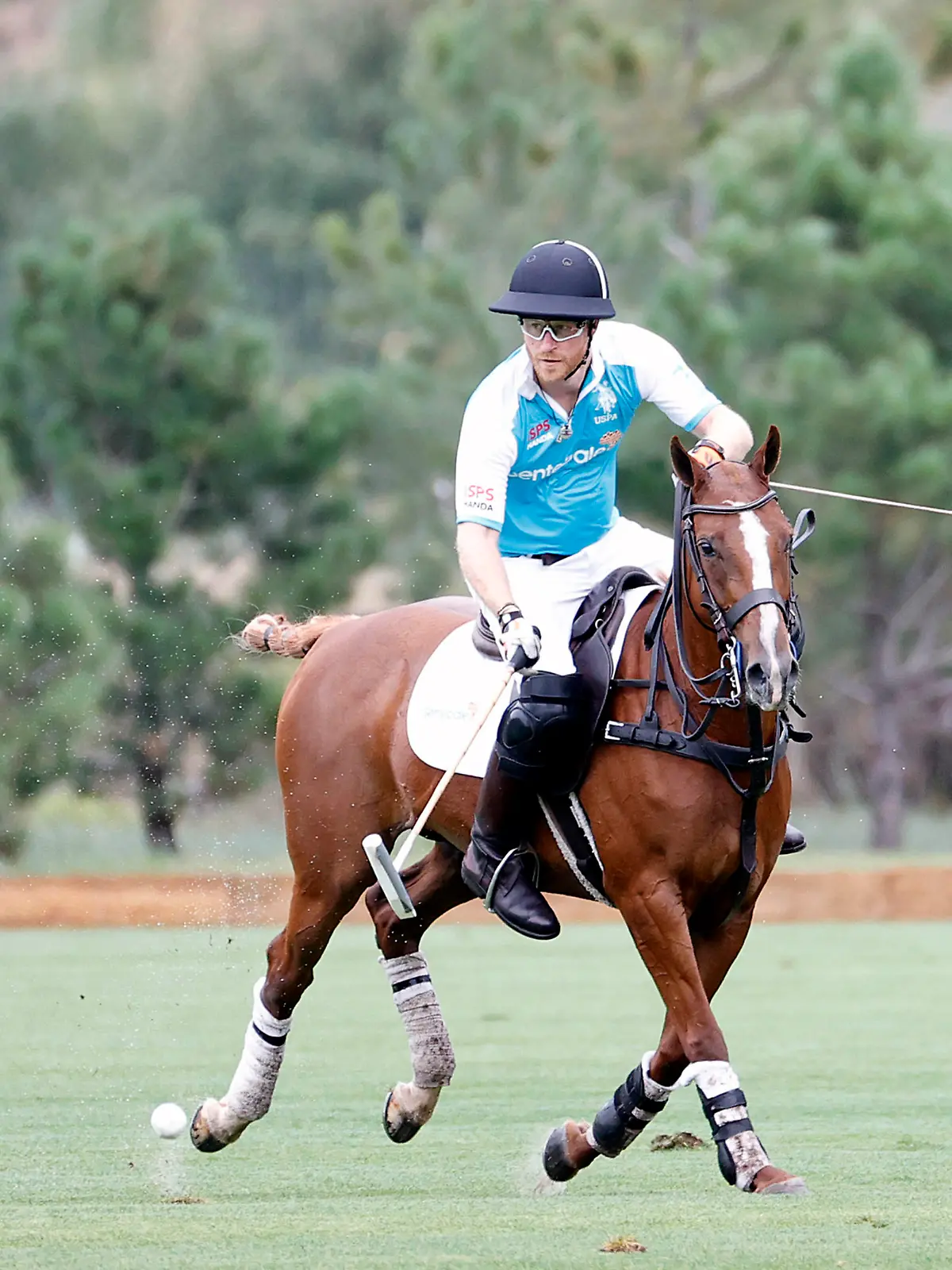 Prince Harry plays polo and helps raise nearly $3.5 million (USD) for vulnerable children in Southern Africa at the Sentebale ISPS Handa Polo Cup. The Duke of Sussex made his first appearance in public since the arrival of daughter Lilibet Diana as Sentebale hosted the charity event at Aspen Valley Polo Club in Colorado on August 19. He announced he will be donating $1.5 million of the proceeds from his forthcoming memoir to the charity, helping Sentebale raise nearly $3.5 million to support children impacted by extreme poverty, inequality and the HIV/AIDS epidemic in Southern Africa. Under guidance from a leading epidemiologist and in coordination with the local Public Health Department, a reduced version of Sentebale’s annual charity sports match took place for the sole purpose of raising vital funds to support Sentebale’s work. The Polo Cup, together with Prince Harry’s personal donation, will allow Sentebale to operate at full scale and will mean more children and young people across Lesotho and Botswana will receive essential support and care, and build skills to be more resilient and self-sufficient in the future. Harry joined Sentebale Ambassador and Argentine high goal polo player Nacho Figueras on the Sentebale Team, battling it out in a round robin tournament against the Royal Salute Team and U.S. Polo Assn. Team. The Sentebale Team were unbeatable, with Harry scoring two goals. Sentebale was founded by Prince Harry and Prince Seeiso in 2006. It means "forget-me-not" in the Sesotho language, representing a pledge to remember the most vulnerable children in Southern Africa. *MANDATORY BYLINE MUST CREDIT: SENTEBALE ISPS HANDA POLO CUP 2021/MEGA. 20 Aug 2021 Pictured: Prince Harry plays polo at the Sentebale ISPS Handa Polo Cup in Aspen. *BYLINE: SENTEBALE ISPS HANDA POLO CUP 2021/Mega. Photo credit: SENTEBALE ISPS HANDA POLO CUP / MEGA TheMegaAgency.com +1 888 505 6342 (Mega Agency TagID: MEGA779857_001.jpg) [Photo via Mega Agency]