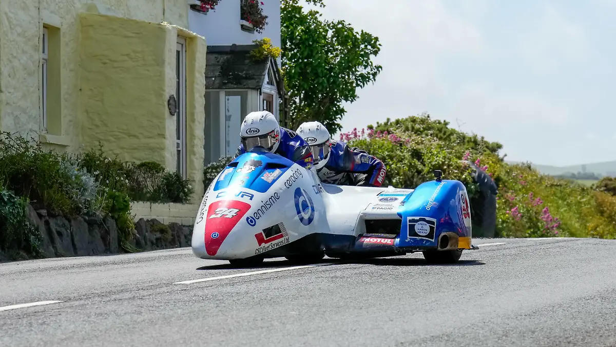 Roger Stockton / Bradley Stockton 600 LCR Suzuki representing the Dennis Menace Racing team during the 3WHEELING.MEDIA Sidecar TT Race 2 at the Isle of Man, Douglas, Isle of Man on the 10 June 2022. PUBLICATIONxNOTxINxUK Copyright: xDavidxHornx PMI-4993-0010