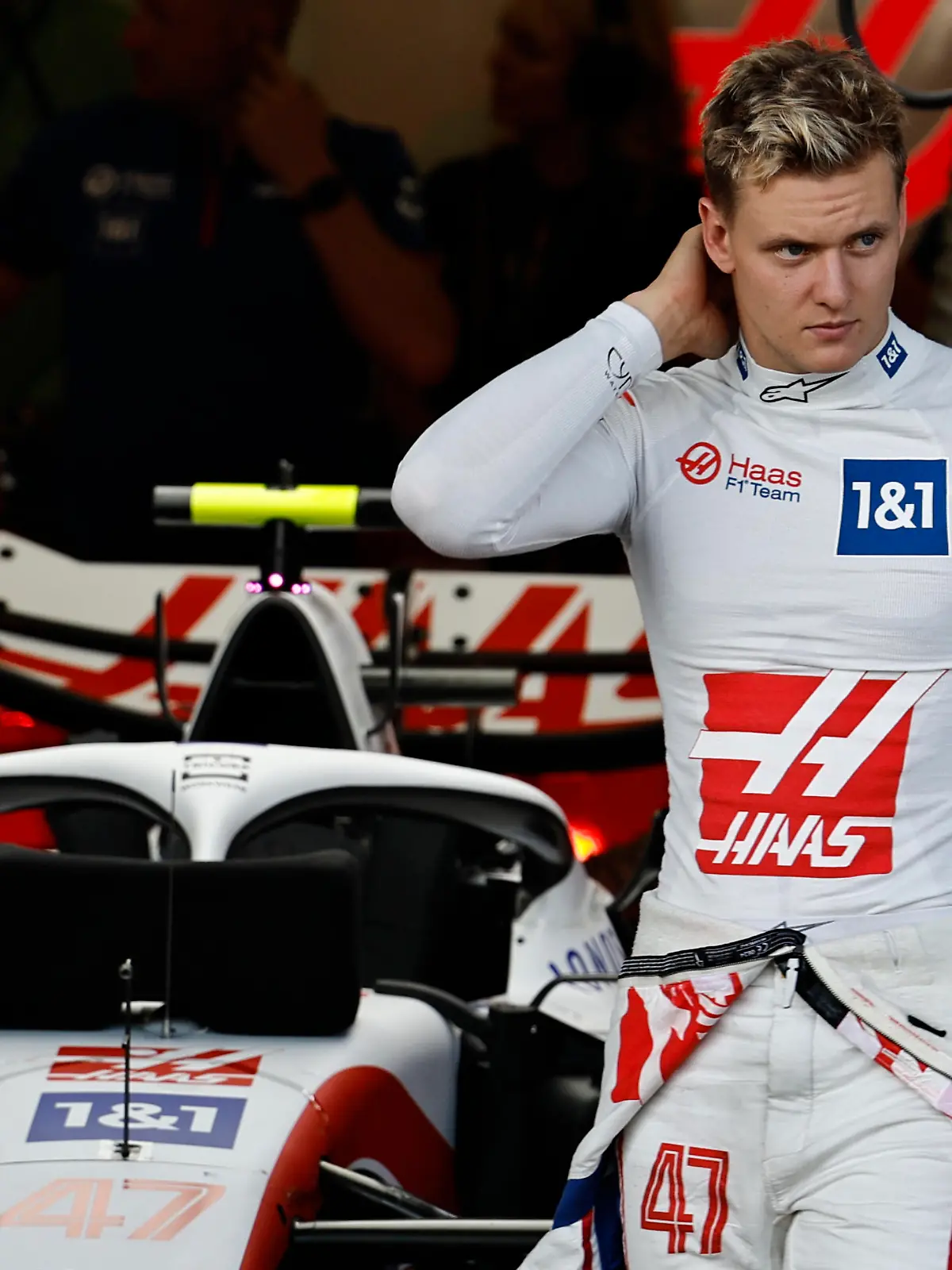 Haas driver Mick Schumacher of Germany stands outside Haas garage during the qualifying session at the Baku circuit, in Baku, Azerbaijan, Saturday, June 11, 2022. The Formula One Grand Prix will be held on Sunday. (Hamad Mohammed), Pool Via AP)