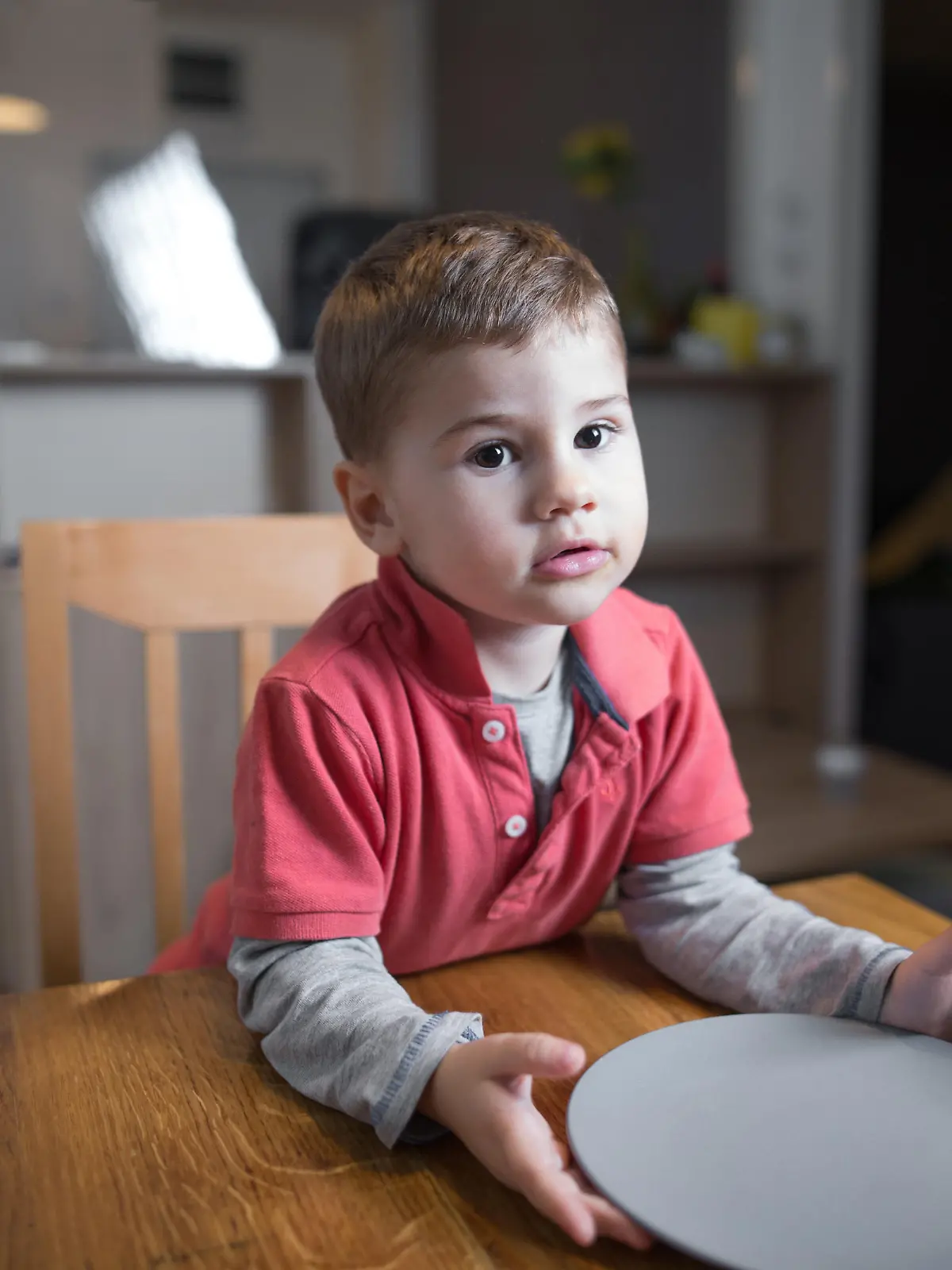Cute little hungry boy waiting for his dinner