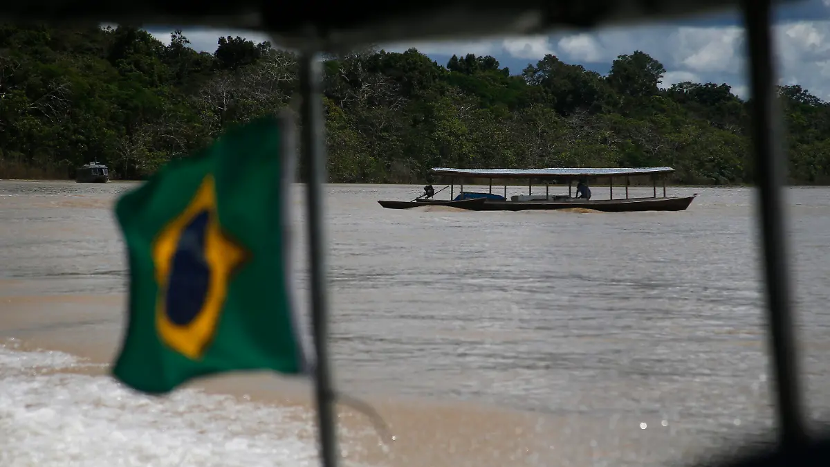 A fisherman navigates his boat on the Itaquai river, Javari Valley Indigenous territory, Atalaia do Norte, Amazonas state, Brazil, Thursday, June 9, 2022. Brazilian authorities are searching for missing journalist Dom Phillips and Indigenous official Bruno Pereira who were last seen on Sunday morning in the Javari Valley, Brazil's second-largest Indigenous territory which sits in an isolated area bordering Peru and Colombia. (AP Photo/Edmar Barros)