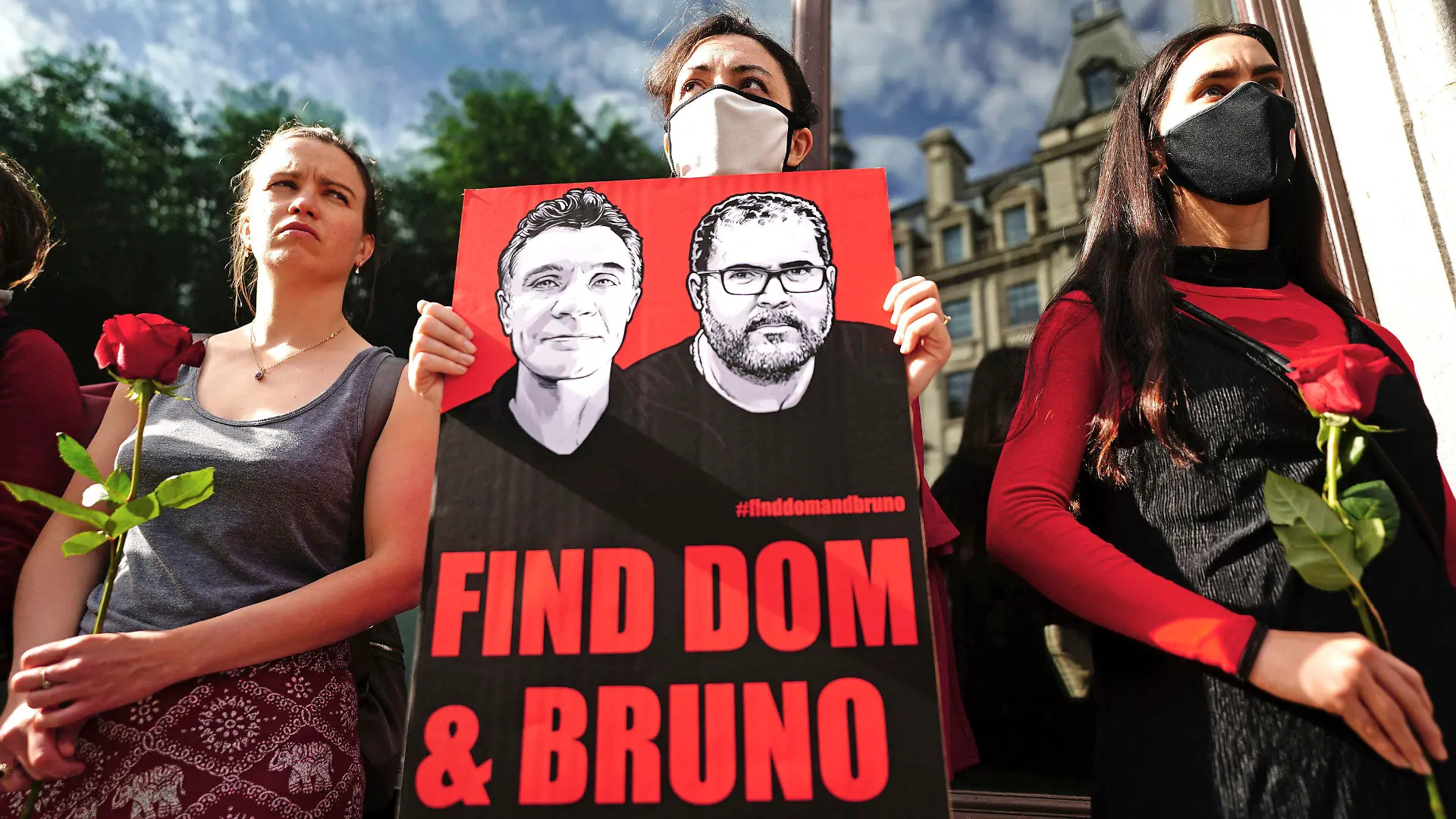 People take part in a vigil outside the Brazilian Embassy for Dom Phillips and Bruno Araujo Pereira, a British journalist and an Indigenous affairs official who are missing in the Amazon, in London, Thursday, June 9, 2022. Brazilian authorities began using helicopters Wednesday to search a remote area of the Amazon rainforest for a British journalist and Indigenous official missing more than three days. (Victoria Jones/PA via AP)