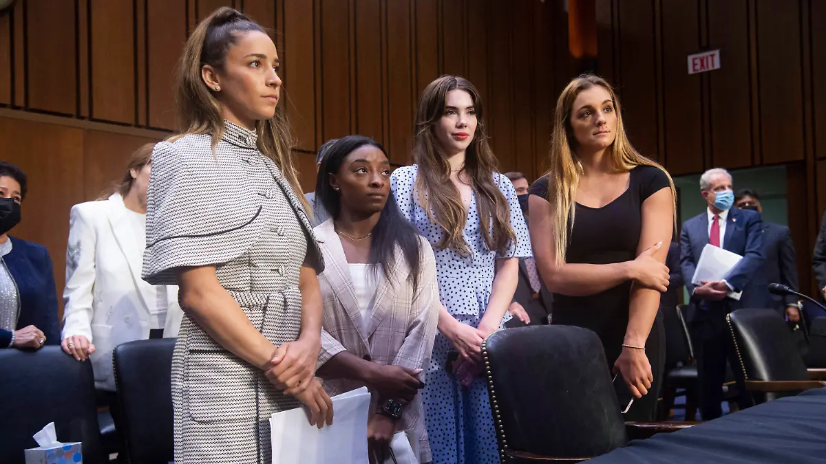 United States gymnasts from left, Aly Raisman, Simone Biles, McKayla Maroney and Maggie Nichols, leave after testifying at a Senate Judiciary hearing about the Inspector General's report on the FBI's handling of the Larry Nassar investigation on Capitol Hill, Wednesday, Sept. 15, 2021, in Washington. Nassar was charged in 2016 with federal child pornography offenses and sexual abuse charges in Michigan. He is now serving decades in prison after hundreds of girls and women said he sexually abused them under the guise of medical treatment when he worked for Michigan State and Indiana-based USA Gymnastics, which trains Olympians. (Saul Loeb/Pool via AP)