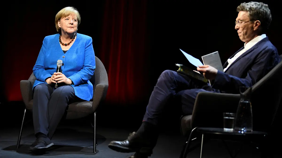 Former German Chancellor Angela Merkel attends a talk about "the challenging issues of our time" with author Alexander Osang at the Berliner Ensemble theatre in Berlin, Germany June 7, 2022. REUTERS/Annegret Hilse