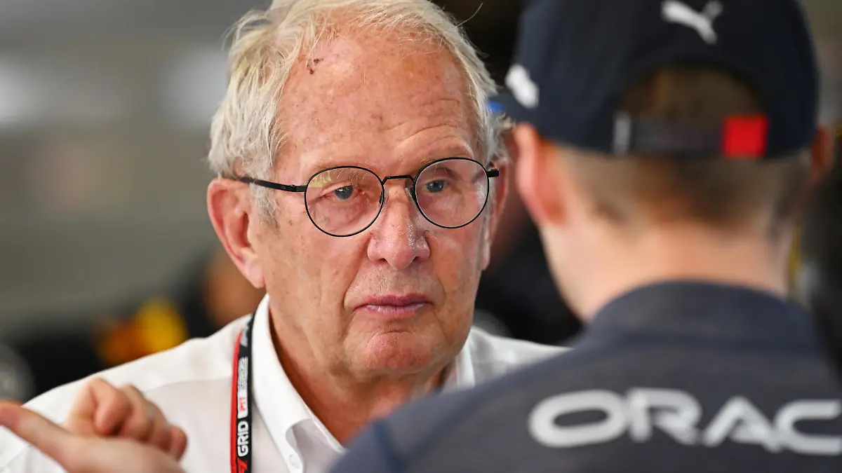 BARCELONA, SPAIN - MAY 21: Max Verstappen of the Netherlands and Oracle Red Bull Racing talks with Red Bull Racing Team Consultant Dr Helmut Marko in the garage during practice ahead of the F1 Grand Prix of Spain at Circuit de Barcelona-Catalunya on May 21, 2022 in Barcelona, Spain. (Photo by Clive Mason/Getty Images)