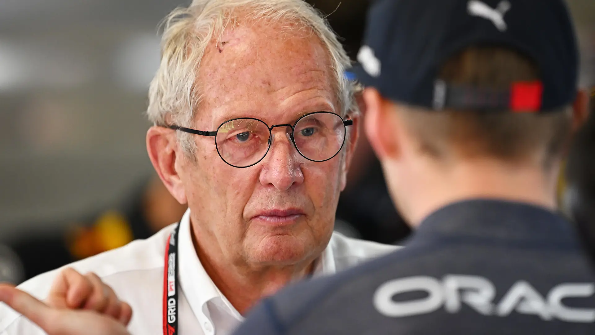 BARCELONA, SPAIN - MAY 21: Max Verstappen of the Netherlands and Oracle Red Bull Racing talks with Red Bull Racing Team Consultant Dr Helmut Marko in the garage during practice ahead of the F1 Grand Prix of Spain at Circuit de Barcelona-Catalunya on May 21, 2022 in Barcelona, Spain. (Photo by Clive Mason/Getty Images)