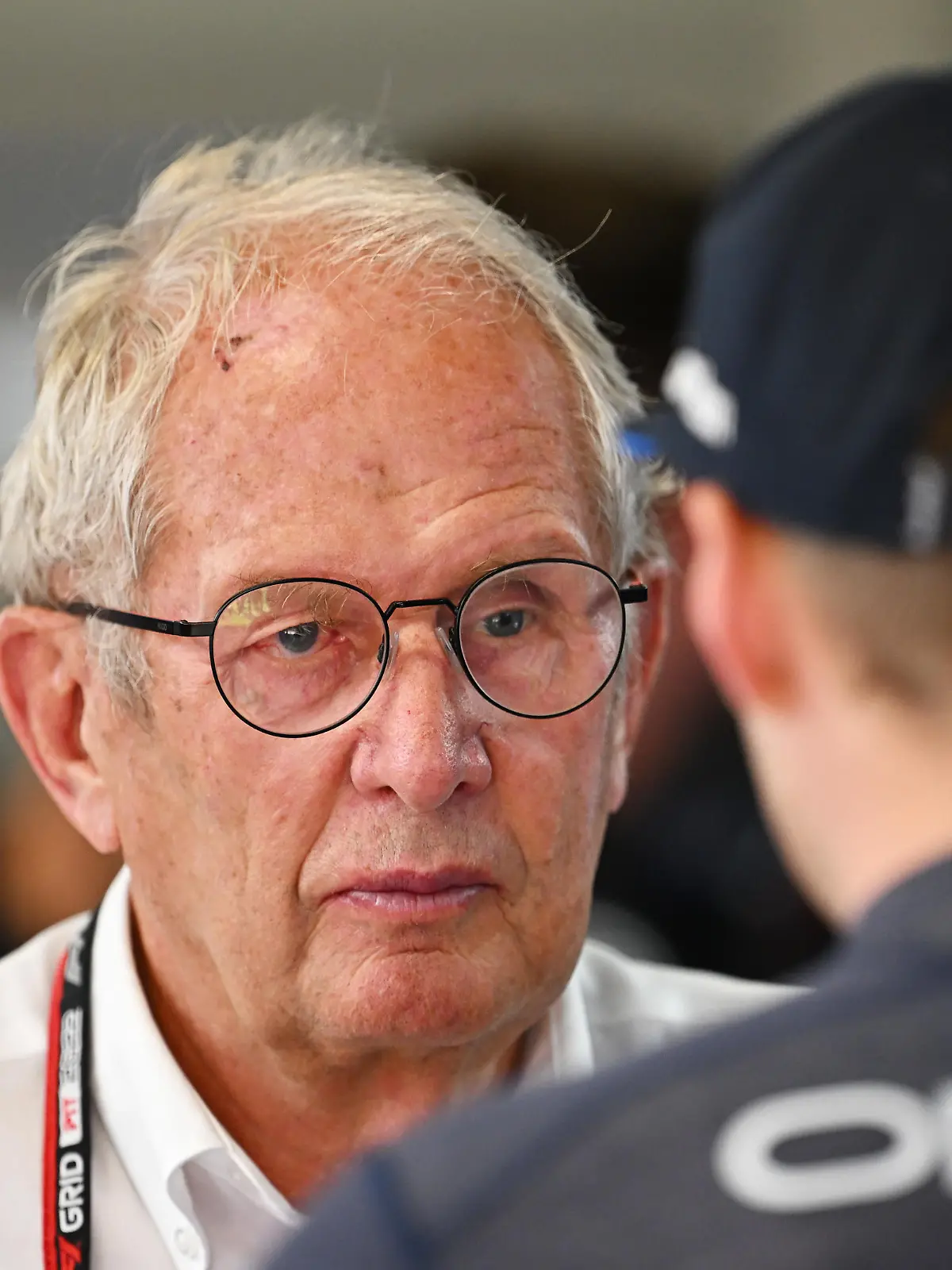 BARCELONA, SPAIN - MAY 21: Max Verstappen of the Netherlands and Oracle Red Bull Racing talks with Red Bull Racing Team Consultant Dr Helmut Marko in the garage during practice ahead of the F1 Grand Prix of Spain at Circuit de Barcelona-Catalunya on May 21, 2022 in Barcelona, Spain. (Photo by Clive Mason/Getty Images)