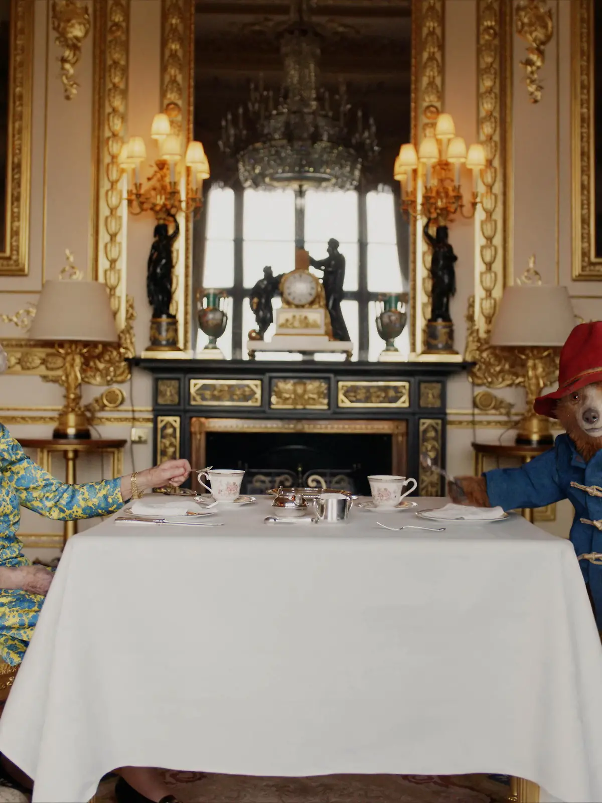Undated image of Britain's Queen Elizabeth and Paddington Bear having cream tea at Buckingham Palace taken from a film that was shown at BBC's Platinum Party at the Palace. Released June 4, 2022. Buckingham Palace/Studio Canal/BBC Studios/Heyday Films/PA Wire/Handout via REUTERS  NO RESALES. NO ARCHIVES. MANDATORY CREDIT. NO COMMERCIAL SALES. MUST NOT BE ALTERED. NO NEW USES AFTER JUNE 30, 2022. NOTE TO EDITORS: This handout photo may only be used in for editorial reporting purposes for the contemporaneous illustration of events, things or the people in the image or facts mentioned in the caption. Reuse of the picture may require further permission from the copyright holder. EDITORIAL USE ONLY. The copyright for the photograph vests with Buckingham Palace/ Studio Canal / BBC Studios. Publications are asked to credit Buckingham Palace/ Studio Canal / BBC Studios / Heyday Films.   The photograph shall not be used without permission from Royal Communications. There shall be no commercial use whatsoever of the photograph (including any use in merchandising, advertising or any other non-editorial use). The photograph must not be digitally enhanced, manipulated or modified in any manner or form when published. The photograph will be free for press usage until 30th June 2022. It must not be used after this date without prior, written permission from Royal Communications, and no further licensing can be made.