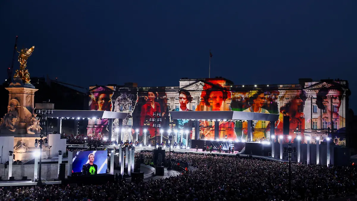 Images of Queen Elizabeth II are projected onto Buckingham Palace as Duran Duran perform during the Platinum Jubilee concert taking place in London, Saturday June 4, 2022, on the third of four days of celebrations to mark the Platinum Jubilee. The events over a long holiday weekend in the U.K. are meant to celebrate Queen Elizabeth II’s 70 years of service. (Hannah McKay/Pool Photo via AP)
