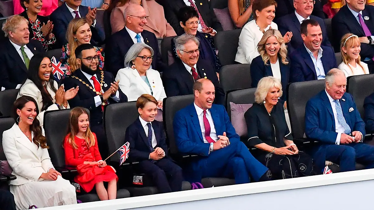 Front row from right, Prince Charles, Camilla, Duchess of Cornwall, Prince William, Prince George, Princess Charlotte, Kate, Duchess of Cambridge watch the Platinum Jubilee concert taking place in front of Buckingham Palace, London, Saturday June 4, 2022, on the third of four days of celebrations to mark the Platinum Jubilee. The events over a long holiday weekend in the U.K. are meant to celebrate Queen Elizabeth II's 70 years of service. (Niklas Halle'n/Pool Photo via AP)