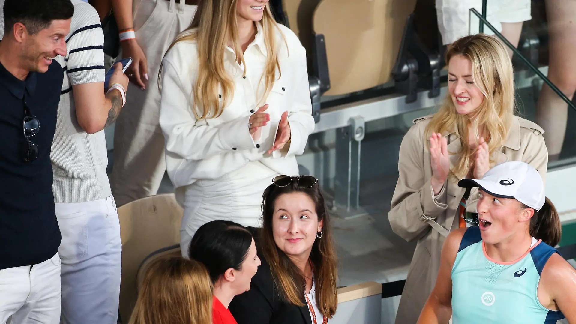 The football player Robert Lewandowski greeting Iga Swiatek after her win against Coco Gauff on Philipe Chatrier court in the 2022 French Open women's final. (Photo by Ibrahim Ezzat/NurPhoto)