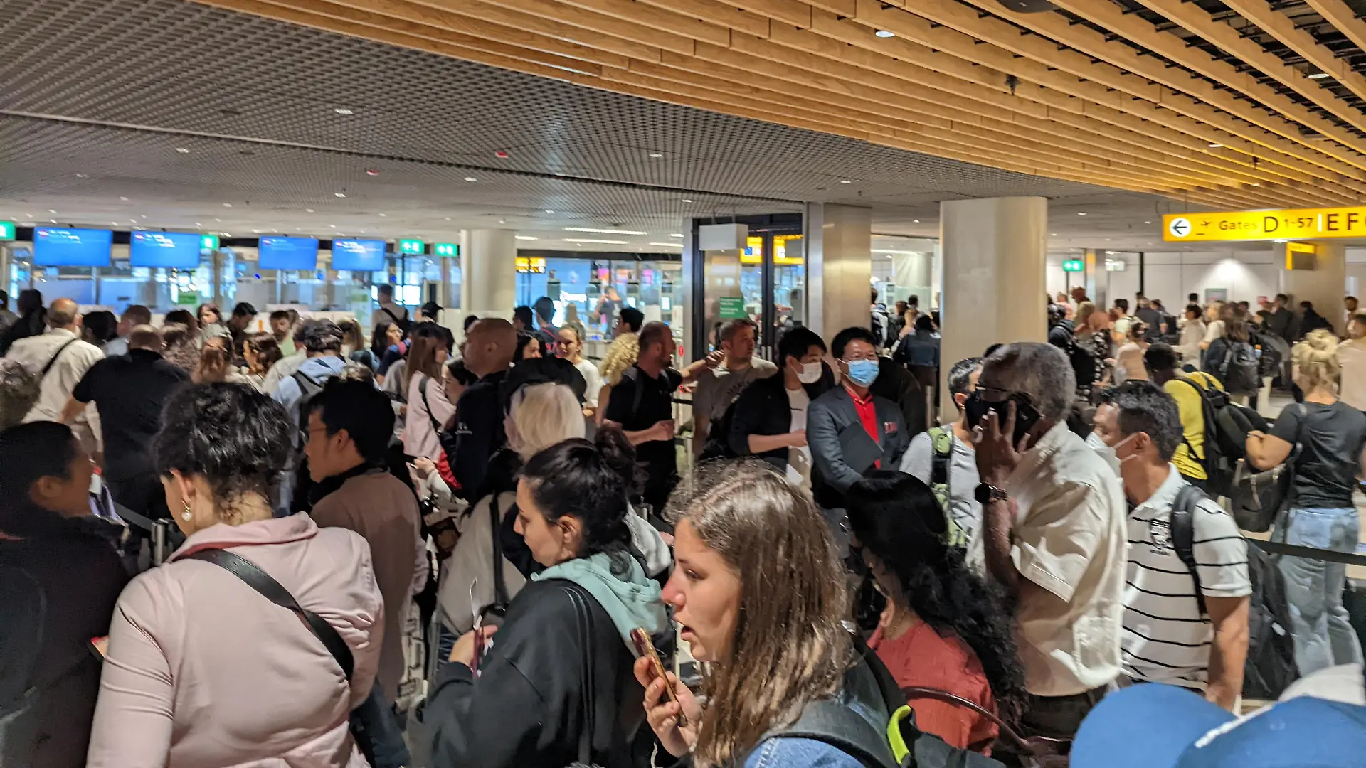 Travelers wait in lines at Amsterdam Schiphol Airport after KLM, the Dutch arm of Air France-KLM, said it would not bring any further passengers on Saturday from European destinations to Amsterdam's Schiphol Airport, its main hub, in Amsterdam, Netherlands June 4, 2022 in this picture obtained from social media. Twitter/Prof. Daniel Angus/via REUTERS THIS IMAGE HAS BEEN SUPPLIED BY A THIRD PARTY. MANDATORY CREDIT. NO RESALES. NO ARCHIVES.