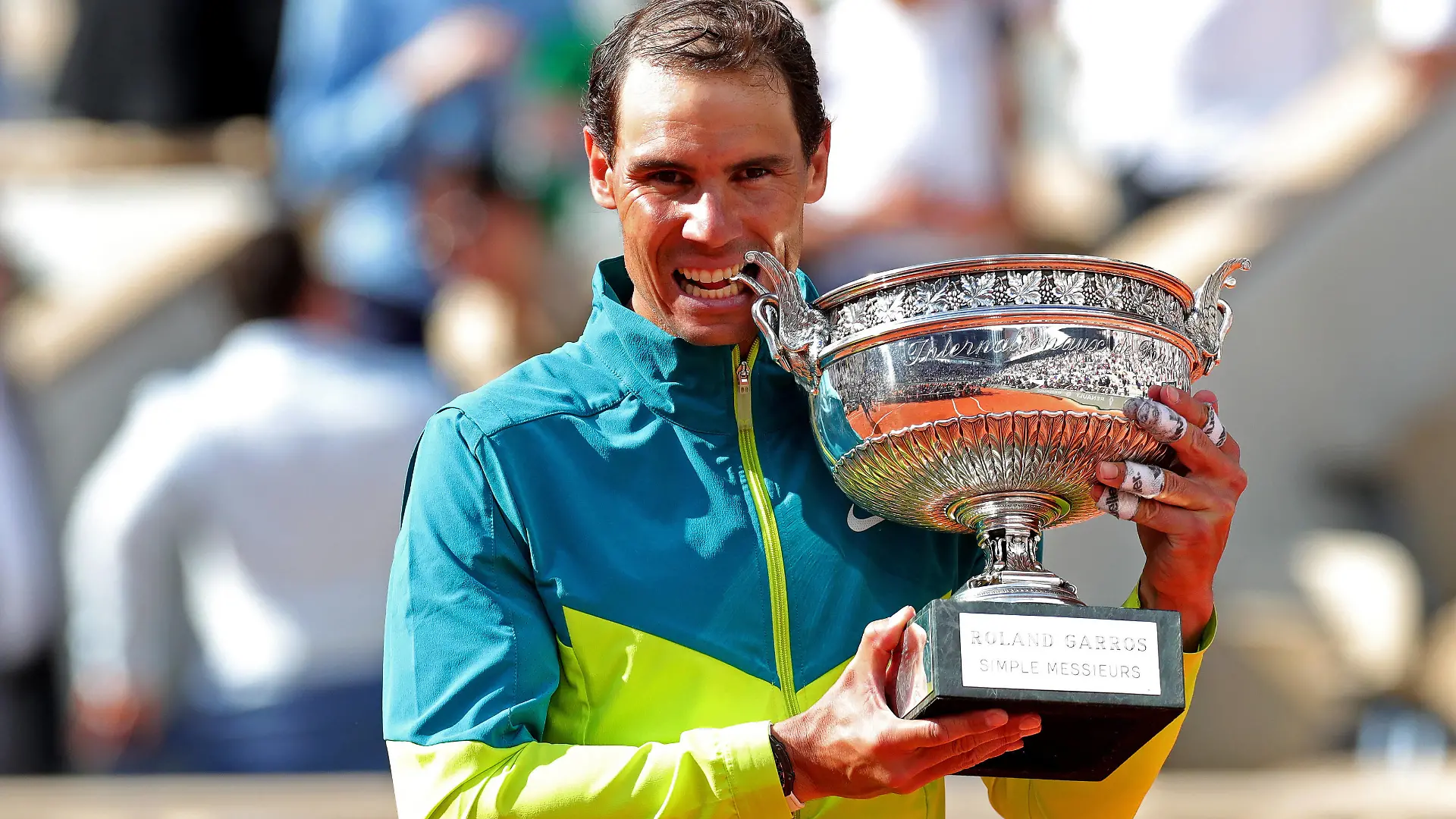 5th June 2022 Roland Garros, Paris, France: French Open Tennis tournament, mens singles final, Rafael Nadal versus Casper Ruud Rafa Nadal ESP bites the winner& x2019s trophy after his win against Casper Ruud NOR PUBLICATIONxNOTxINxUK ActionPlus12397498 JonxBromley