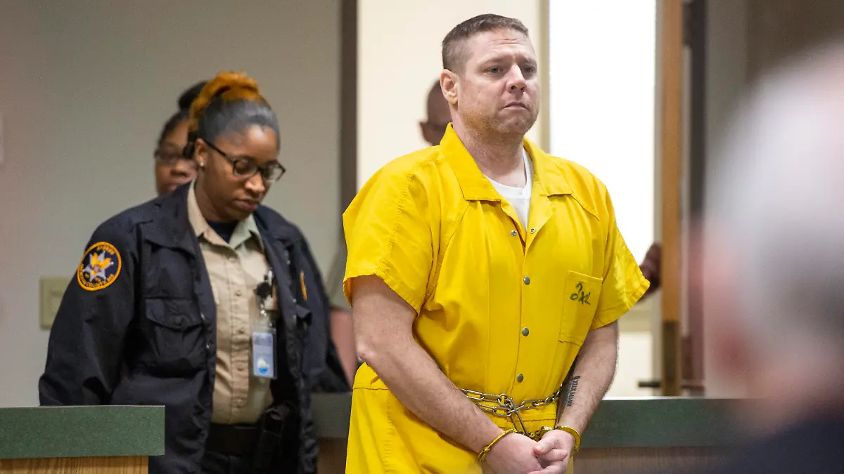 Jacob Blair Scott is led into the courtroom for his sentencing hearing following a trial in which the jury gave its verdict that Scott was guilty on all charges in Jackson County Circuit Court in Pascagoula, Miss., on Thursday, June 2, 2022. Scott, convicted of sexually assaulting a girl and impregnating her when he was 40 and she was 14, was sentenced him to 85 years in prison. (Hannah Ruhoff/The Sun Herald via AP)
