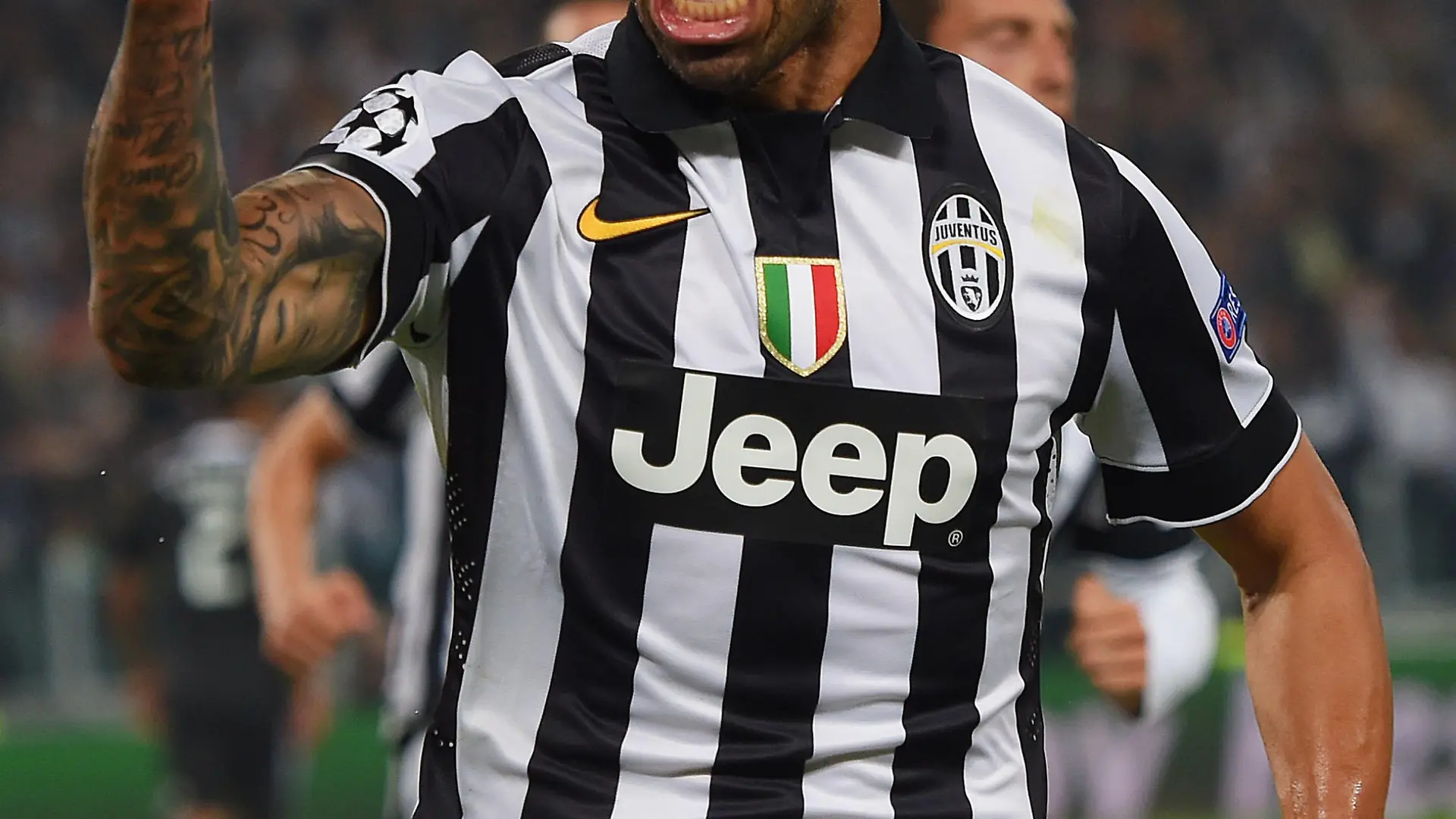 TURIN, ENGLAND - MAY 05: Carlos Tevez of Juventus celebrates as he scores their second goal from a penalty during the UEFA Champions League semi final first leg match between Juventus and Real Madrid CF at Juventus Arena on May 5, 2015 in Turin, Italy. (Photo by Michael Regan/Getty Images)