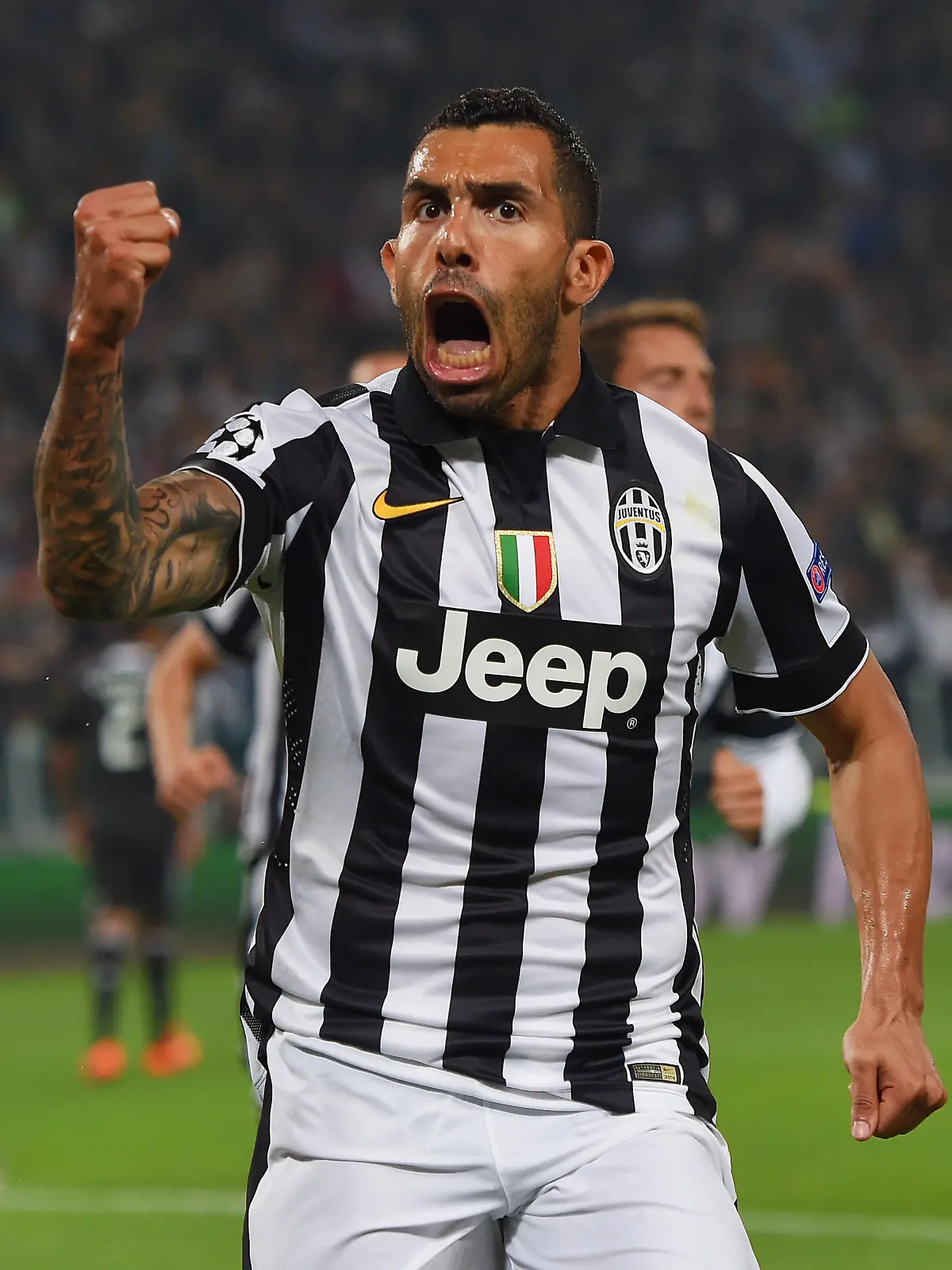 TURIN, ENGLAND - MAY 05:  Carlos Tevez of Juventus celebrates as he scores their second goal from a penalty during the UEFA Champions League semi final first leg match between Juventus and Real Madrid CF at Juventus Arena on May 5, 2015 in Turin, Italy.  (Photo by Michael Regan/Getty Images)