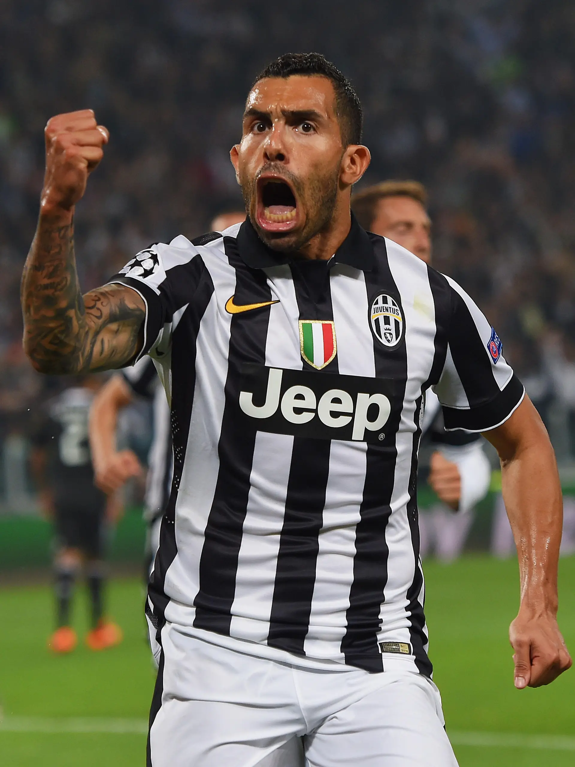 TURIN, ENGLAND - MAY 05:  Carlos Tevez of Juventus celebrates as he scores their second goal from a penalty during the UEFA Champions League semi final first leg match between Juventus and Real Madrid CF at Juventus Arena on May 5, 2015 in Turin, Italy.  (Photo by Michael Regan/Getty Images)